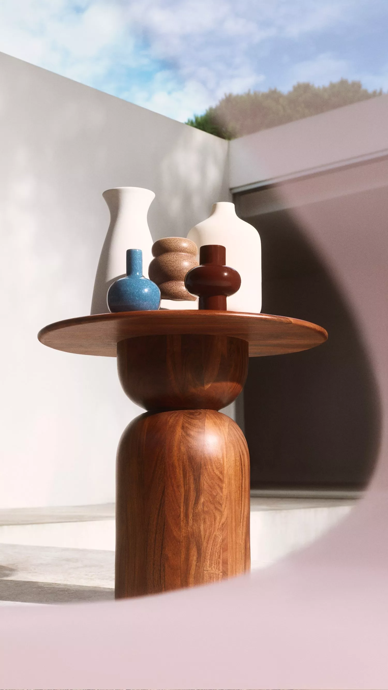 multiple home vases on a wooden table 