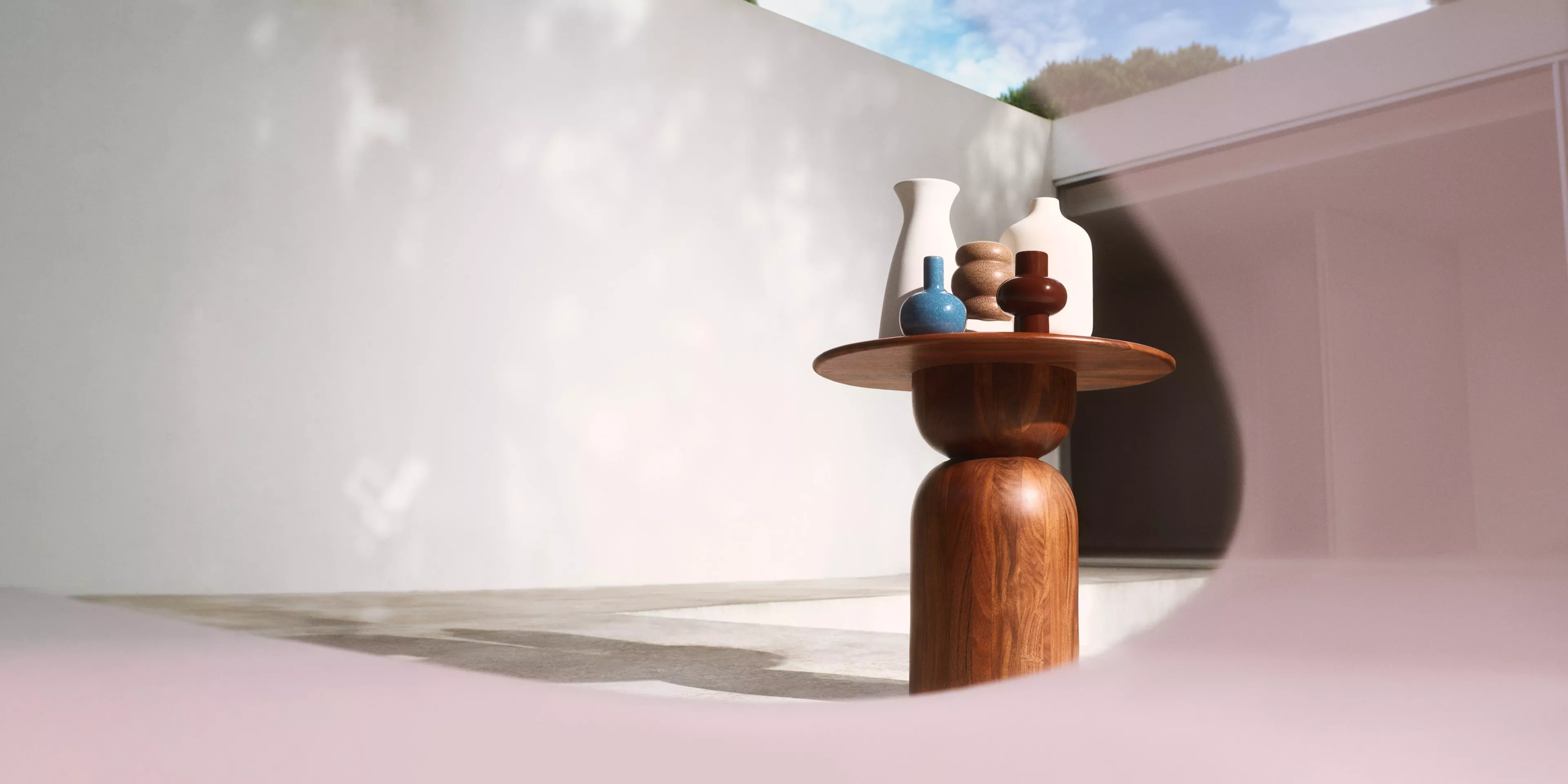 multiple home vases on a wooden table 