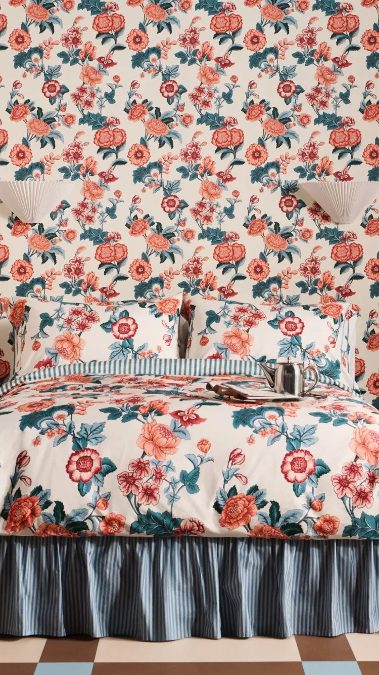 picture of a bedroom decorated with sanderson wallpaper and bedding