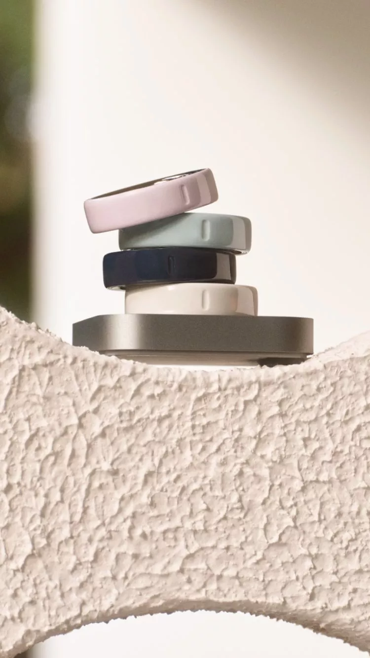 smart rings sitting ontop of a cream wall