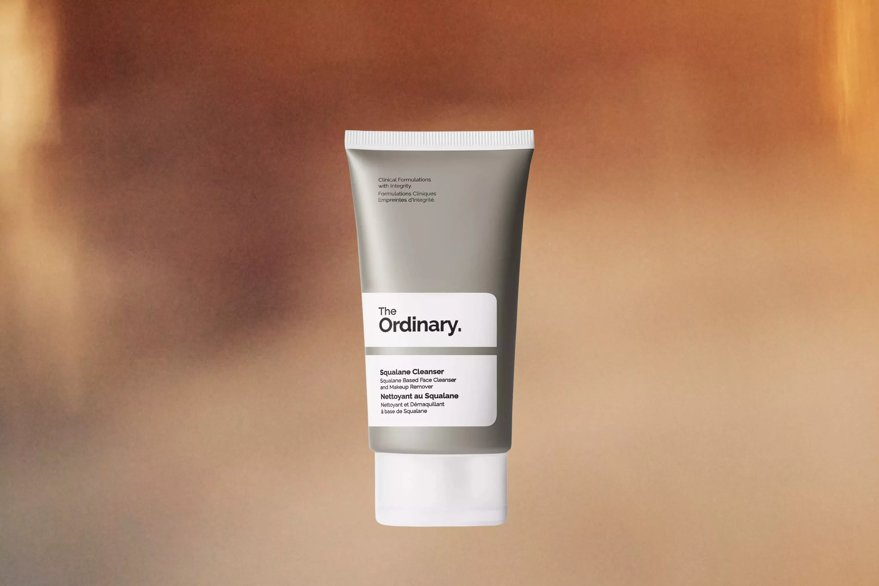The Ordinary Squalane Cleanser cutout on a mottled background