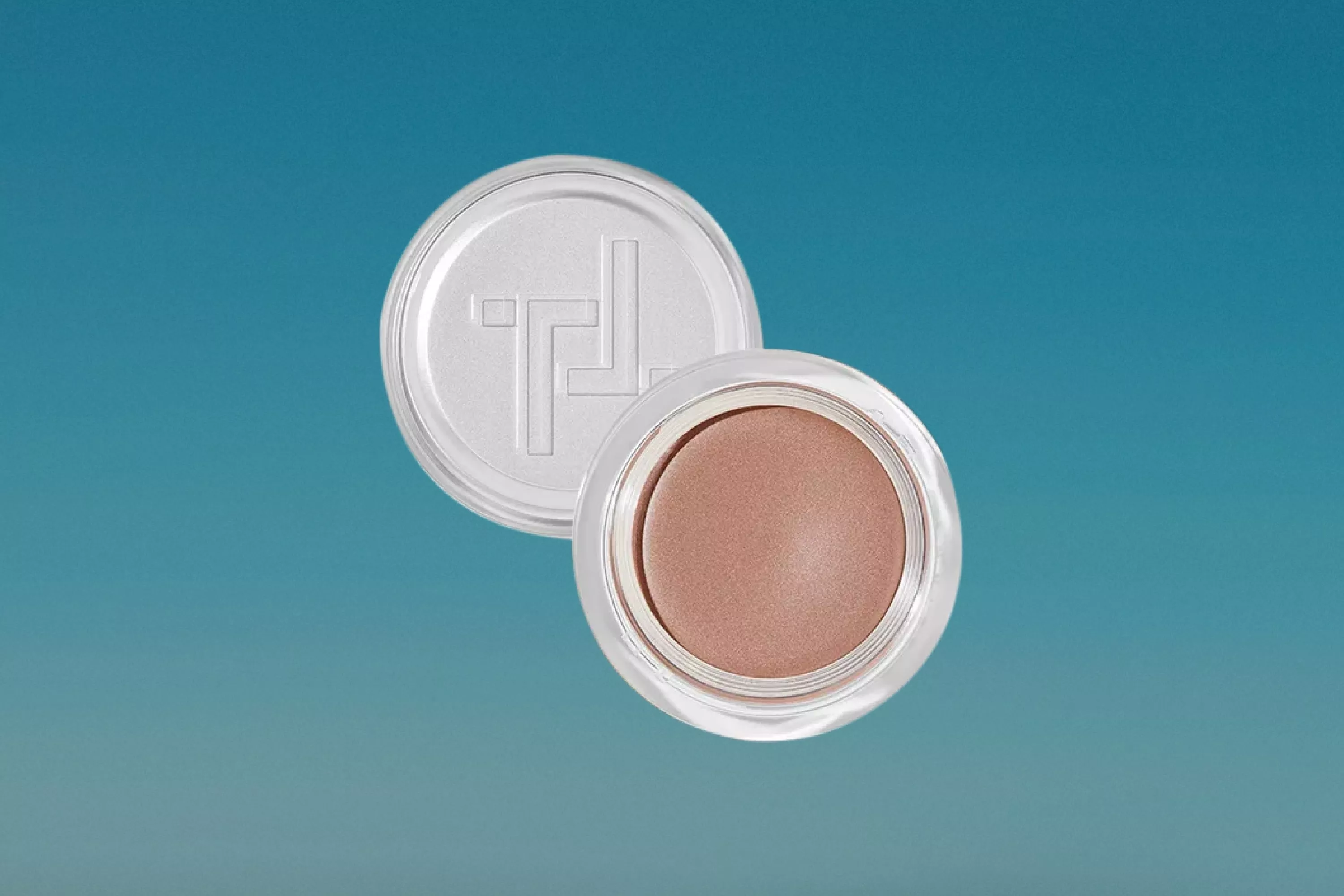 Trinny London Eye2Eye Eyeshadow Satin cutout on a blue background 