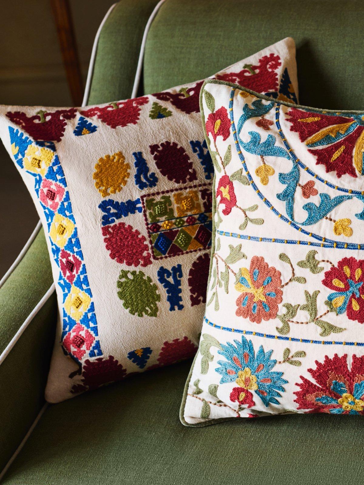 close up of the colourful embrodered cushions
