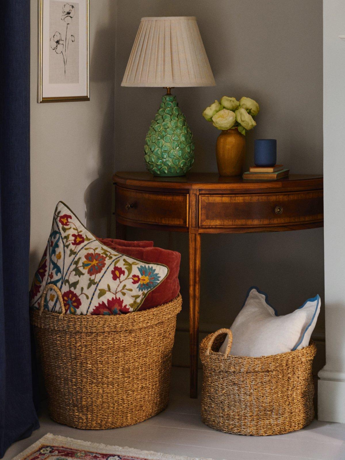 A variety of Modern Luxe vases and a table lamp displayed