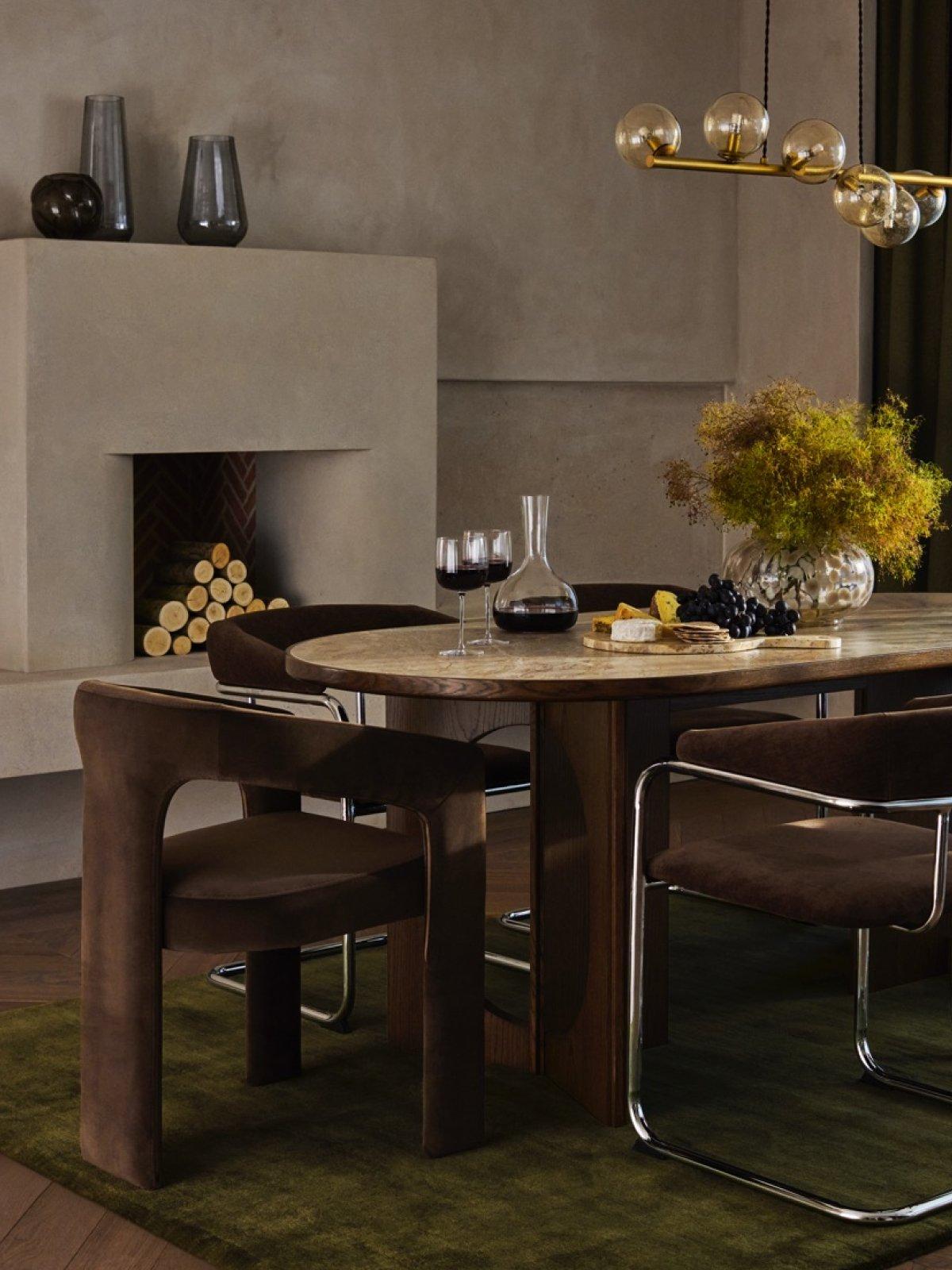 Modern Luxe dining table and chairs with various tableware and homeware