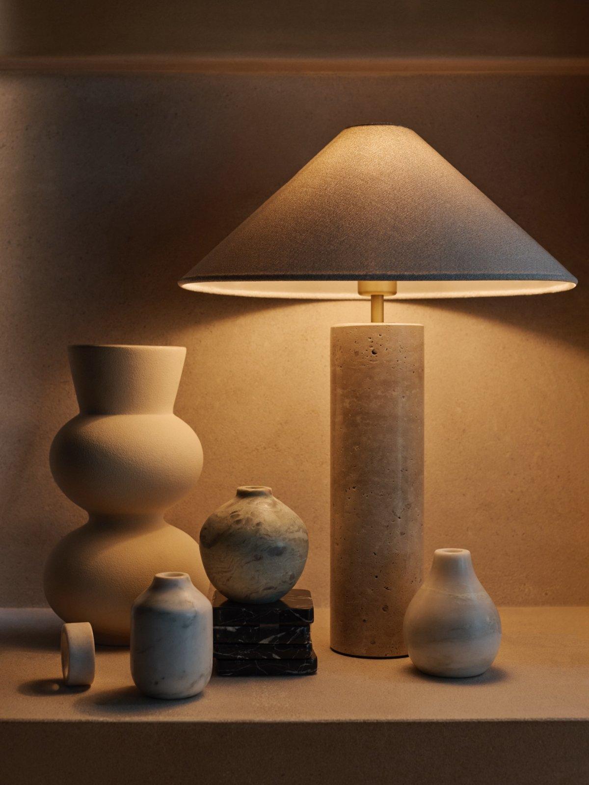 A variety of Modern Luxe vases and a table lamp displayed
