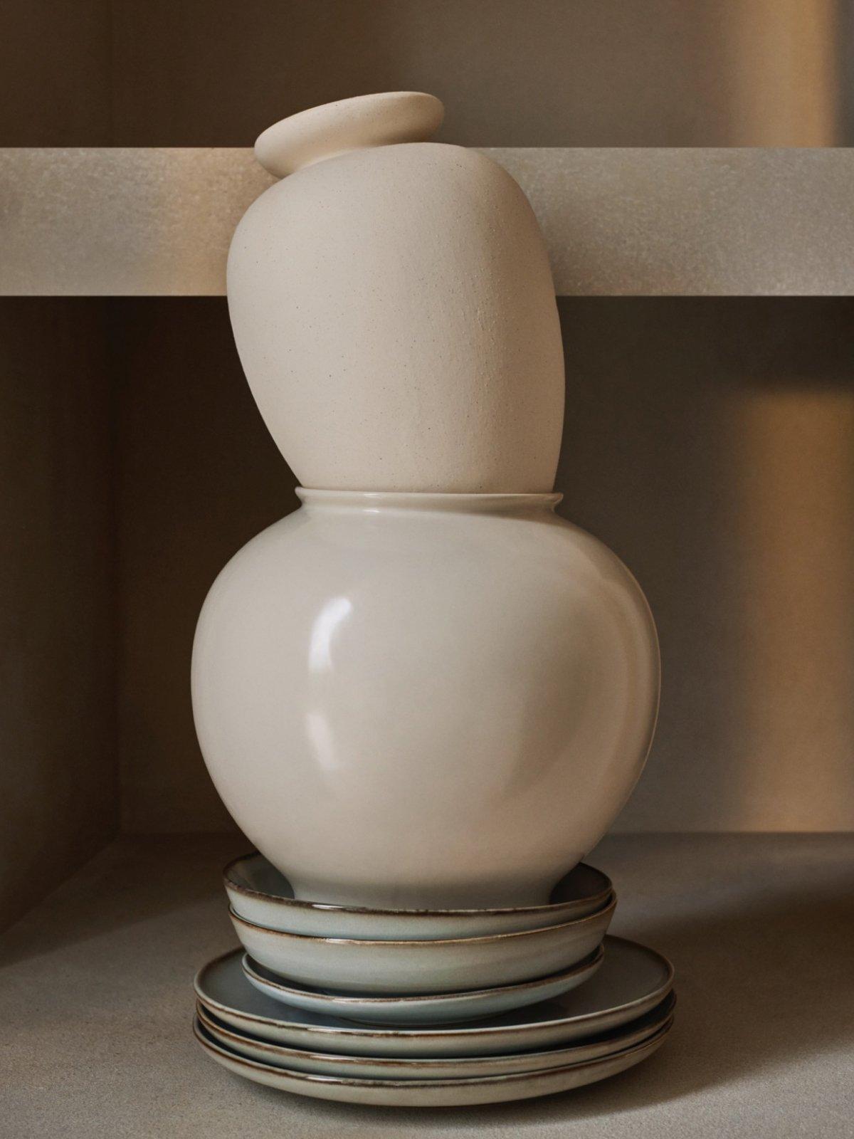 Selection of tableware displayed on a wooden dining table