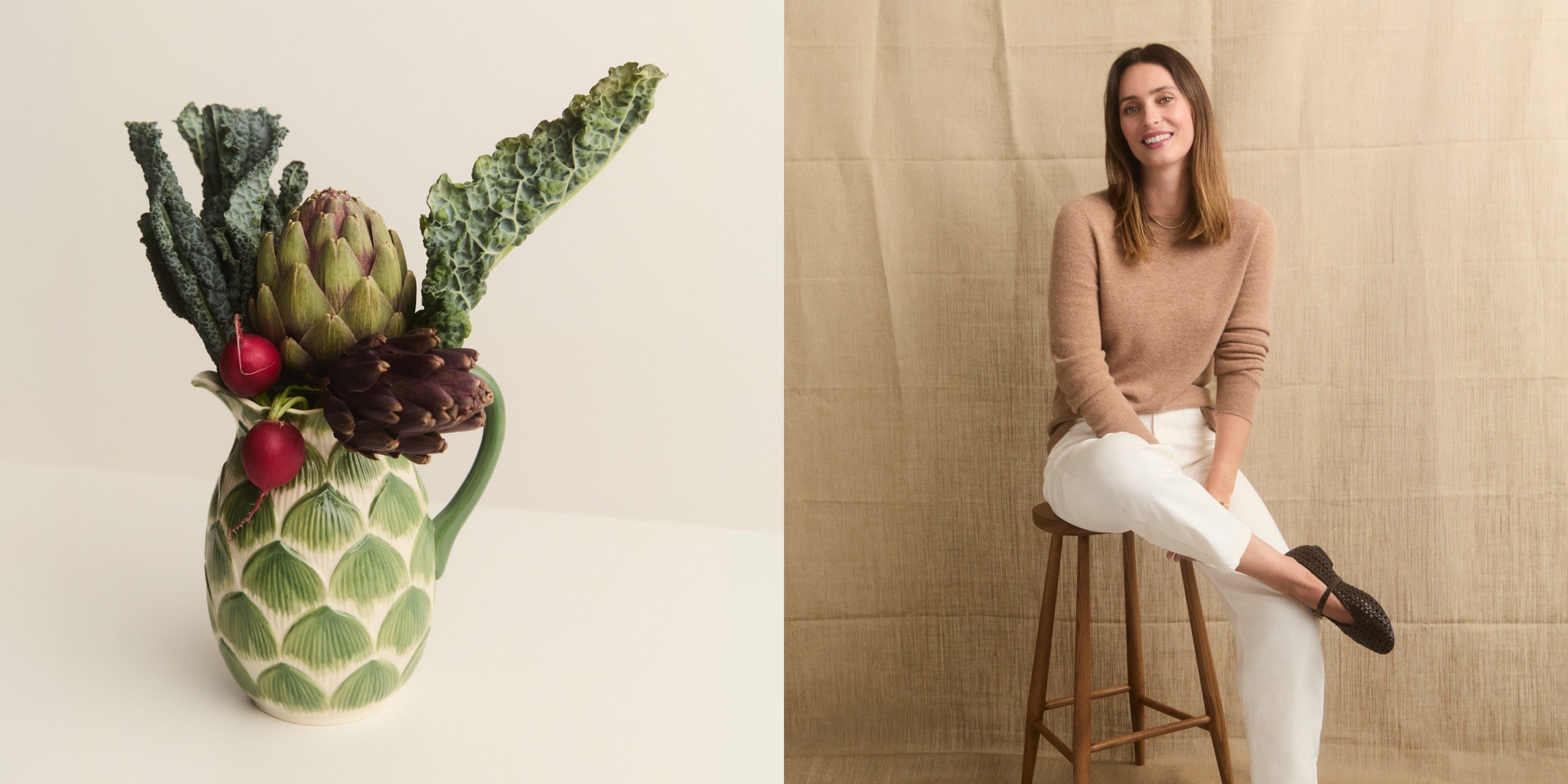 Ella sitting and smiling at the camera on the right, with a green vase containing vegetables on the left