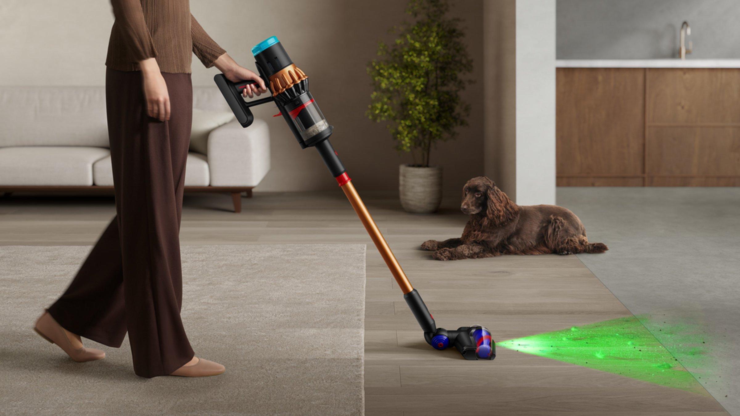 Female model cleaning the living room area with the Dyson V16 Piston Animal Submarine™ vacuum