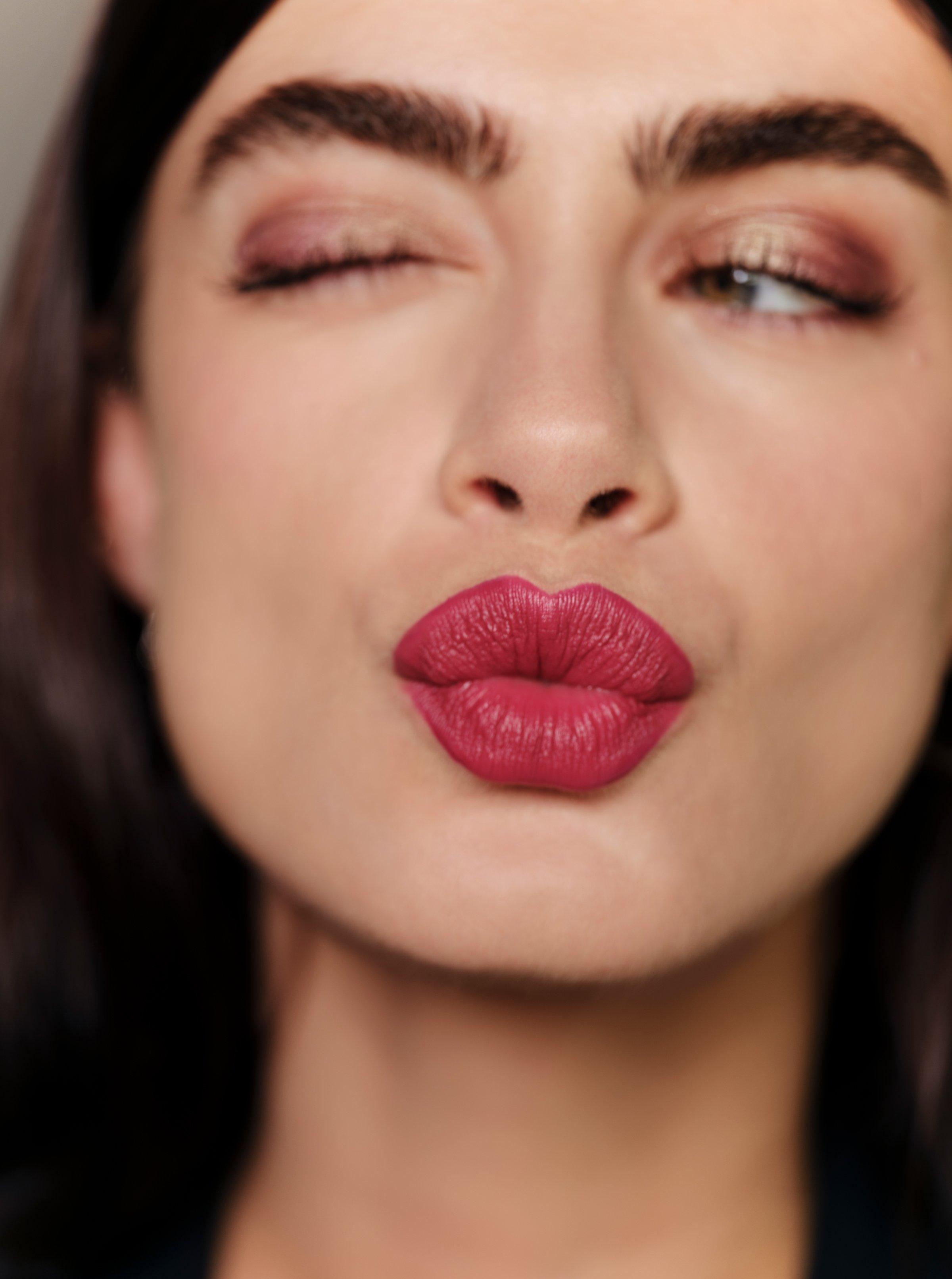 A model wearing Sisley-Paris Phyto-Lèvres Perfect Lip Pencil