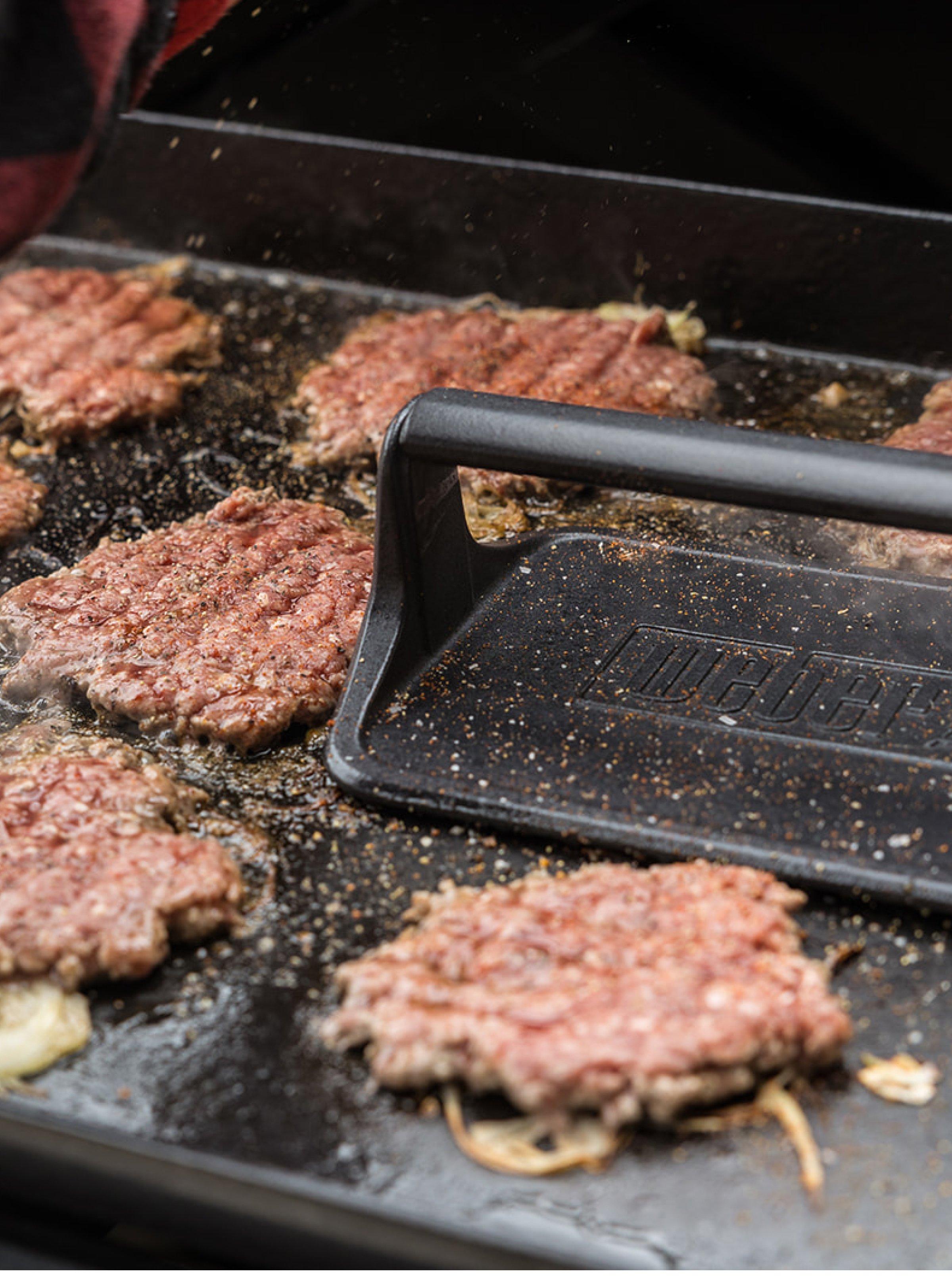Grilling burgers on a Weber Slate Premium Griddle GPS6 Gas Grill