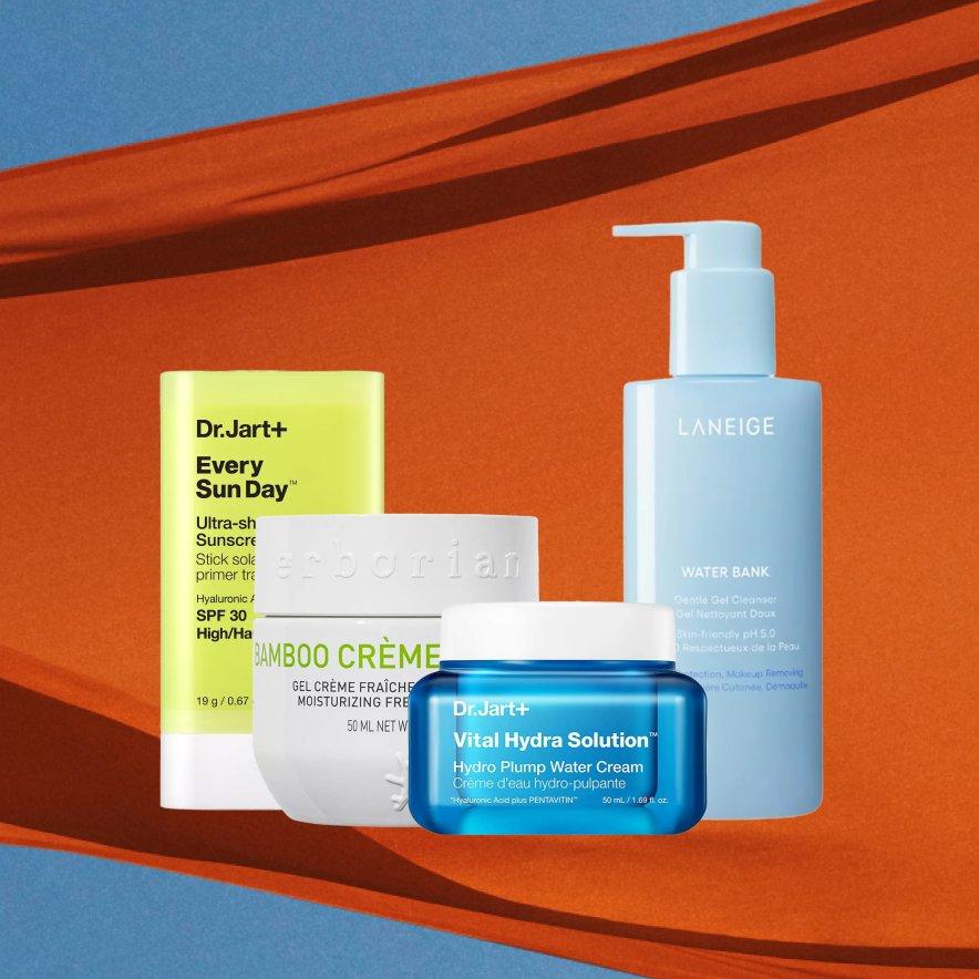 Selection of Korean beauty products displayed in front of an orange background