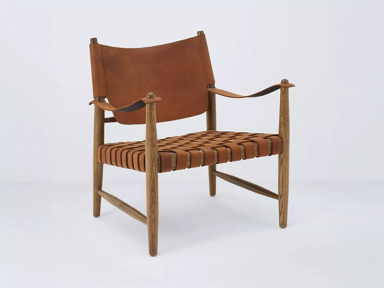 A wooden chair with brown leather seat and backrest, featuring a woven design and leather armrests.