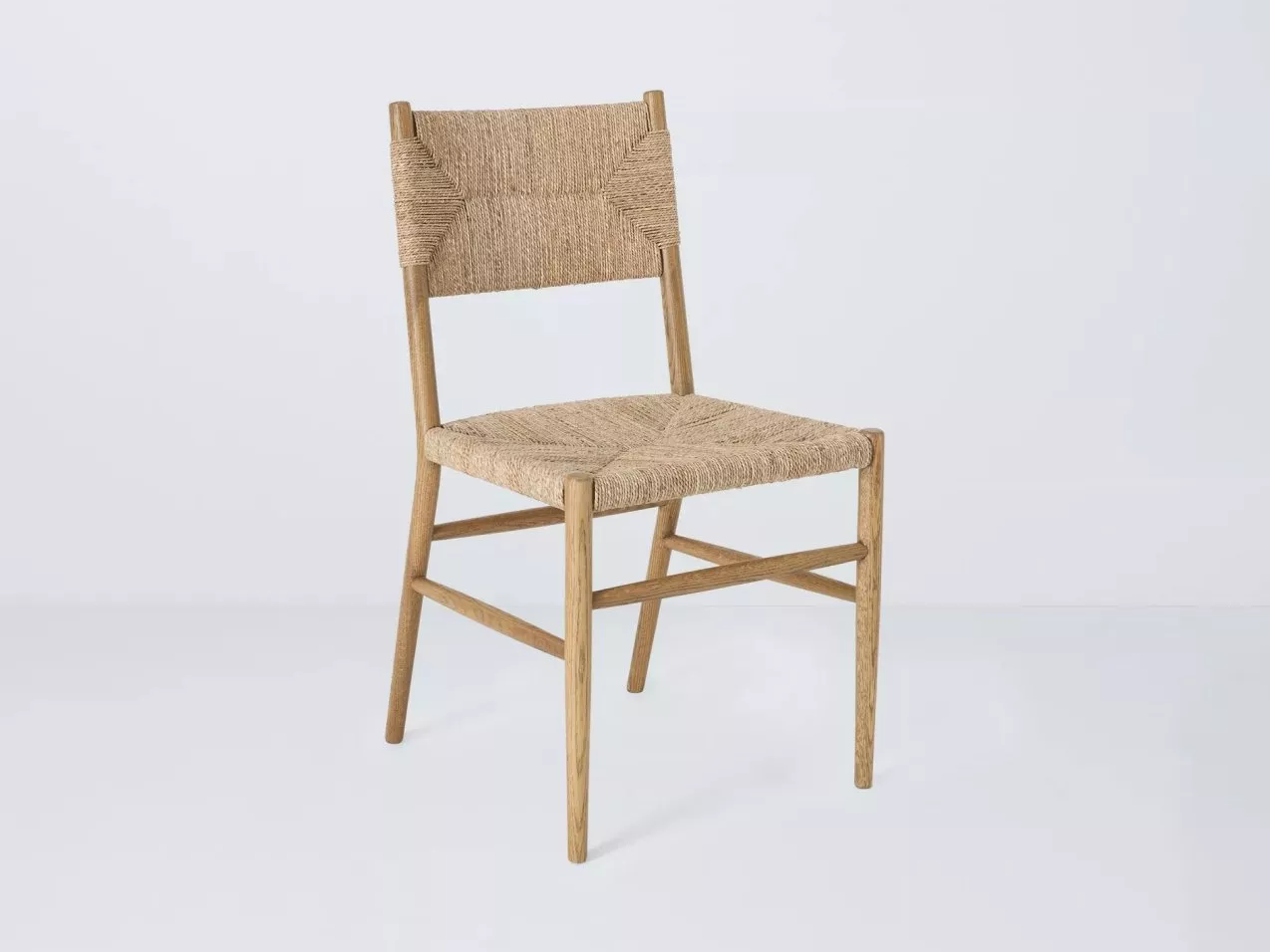 A wooden chair with woven backrest and seat.