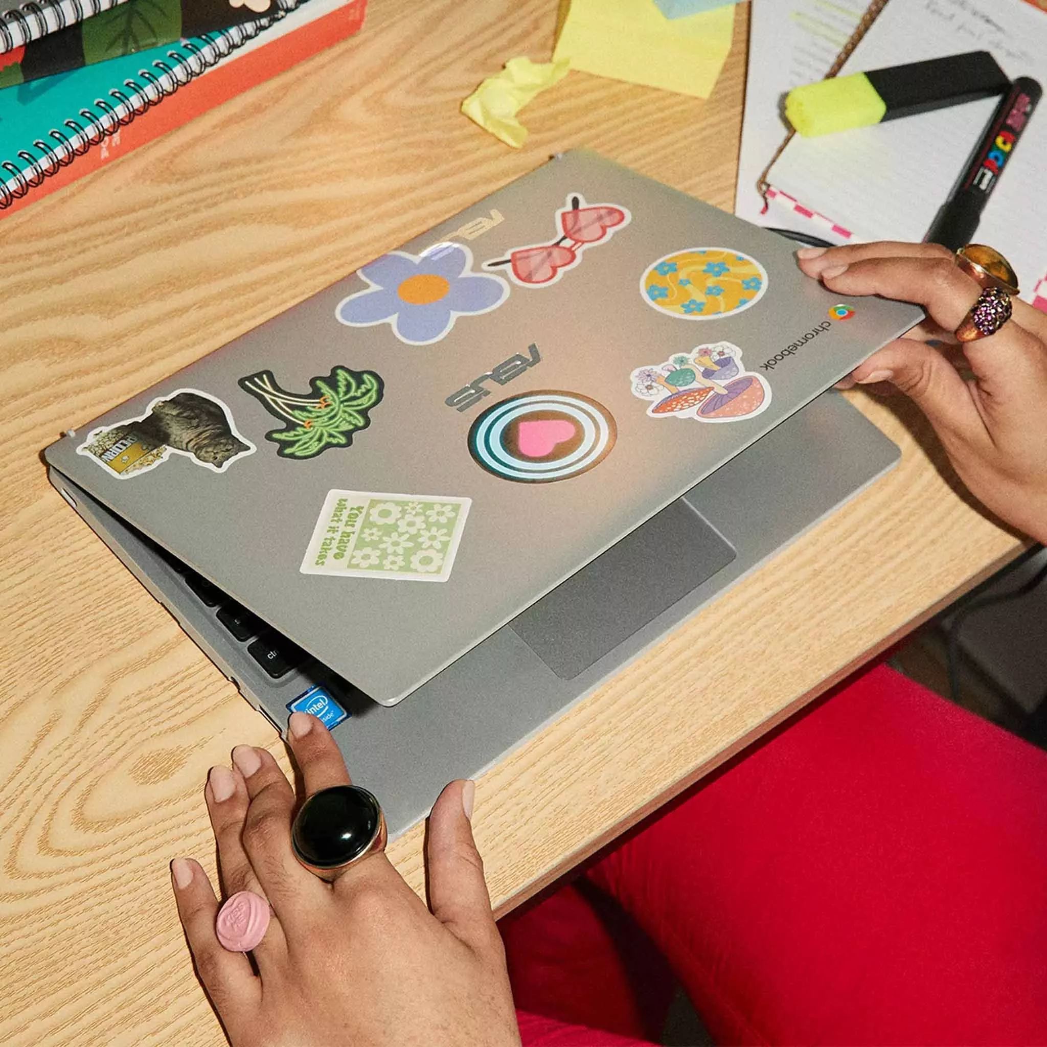 sliver asus laptop on a brown desk 
