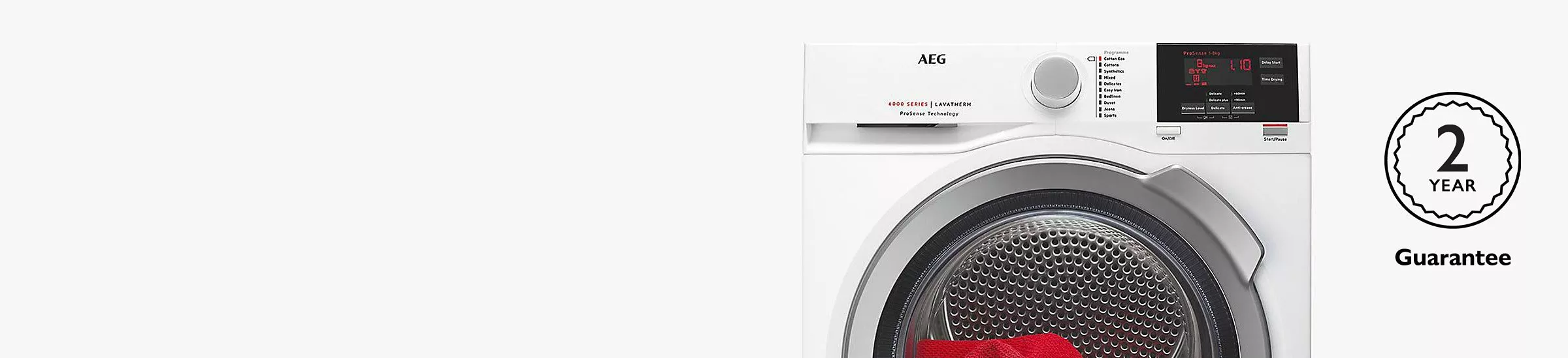 AEG front-load tumble dryer with digital display and dial controls, plus 2-year guarantee badge on right