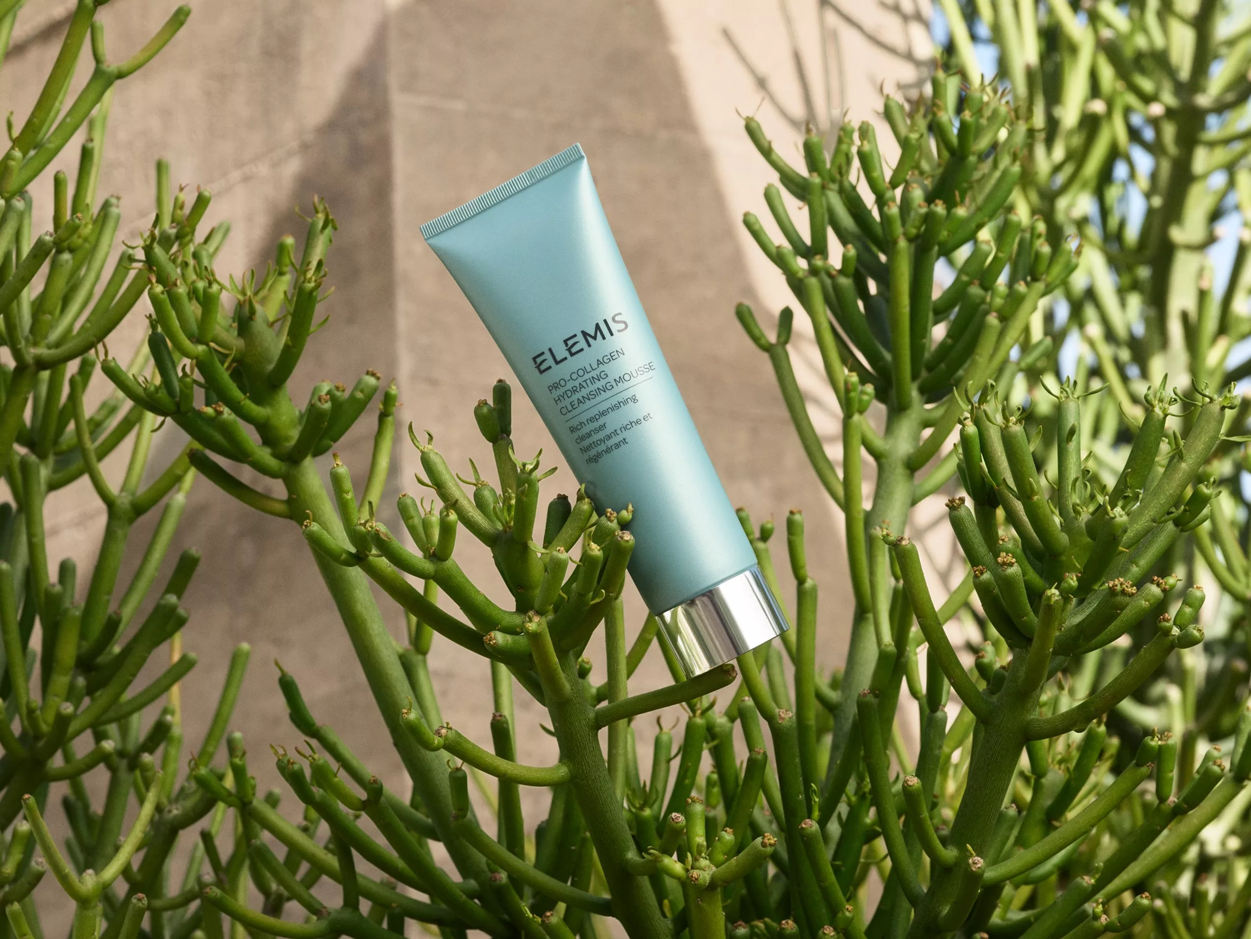 Model holding Elemis cleansing mousse