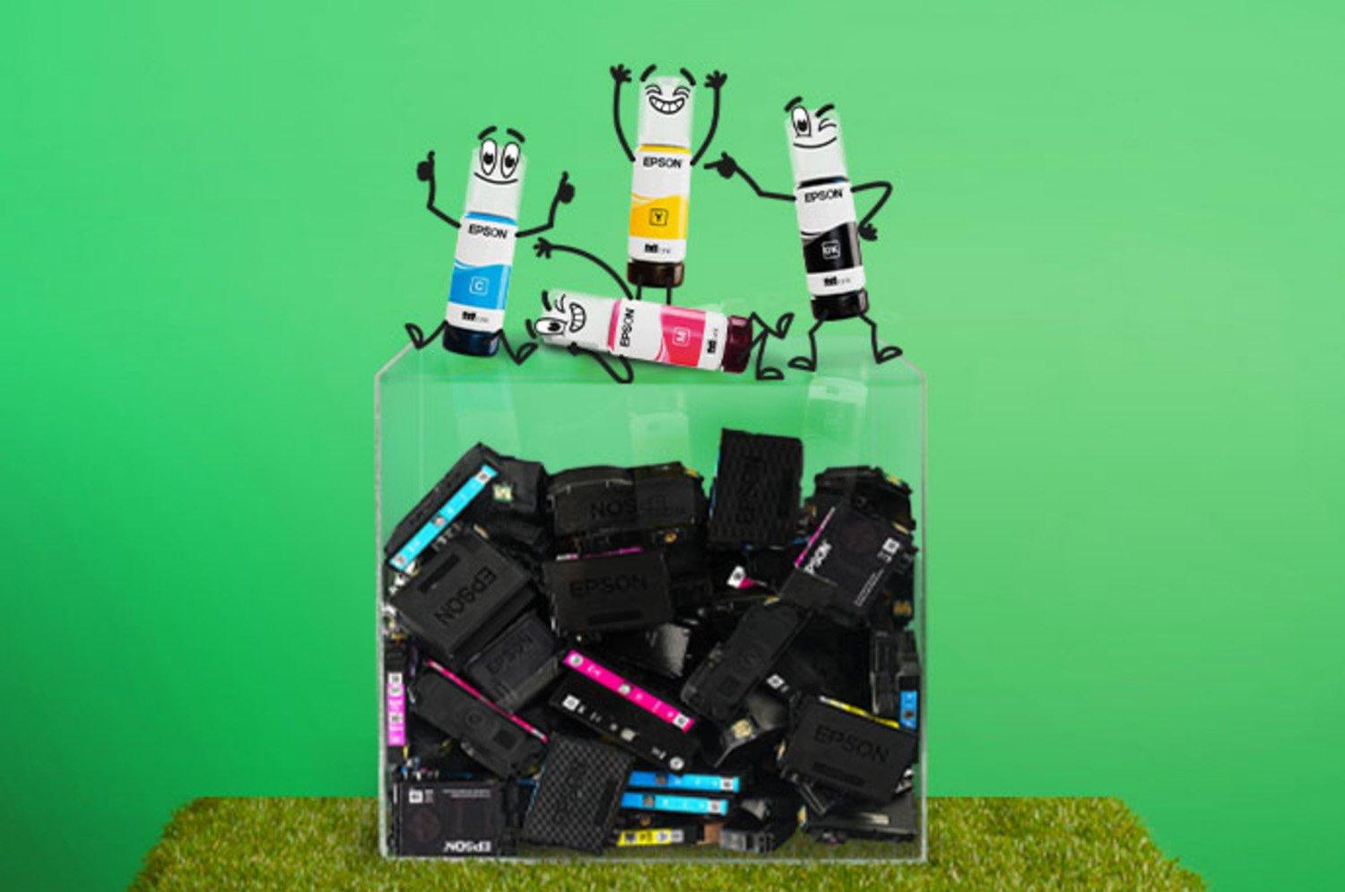 Epson ecotank cartridges standing top of container of standard ink cartridges