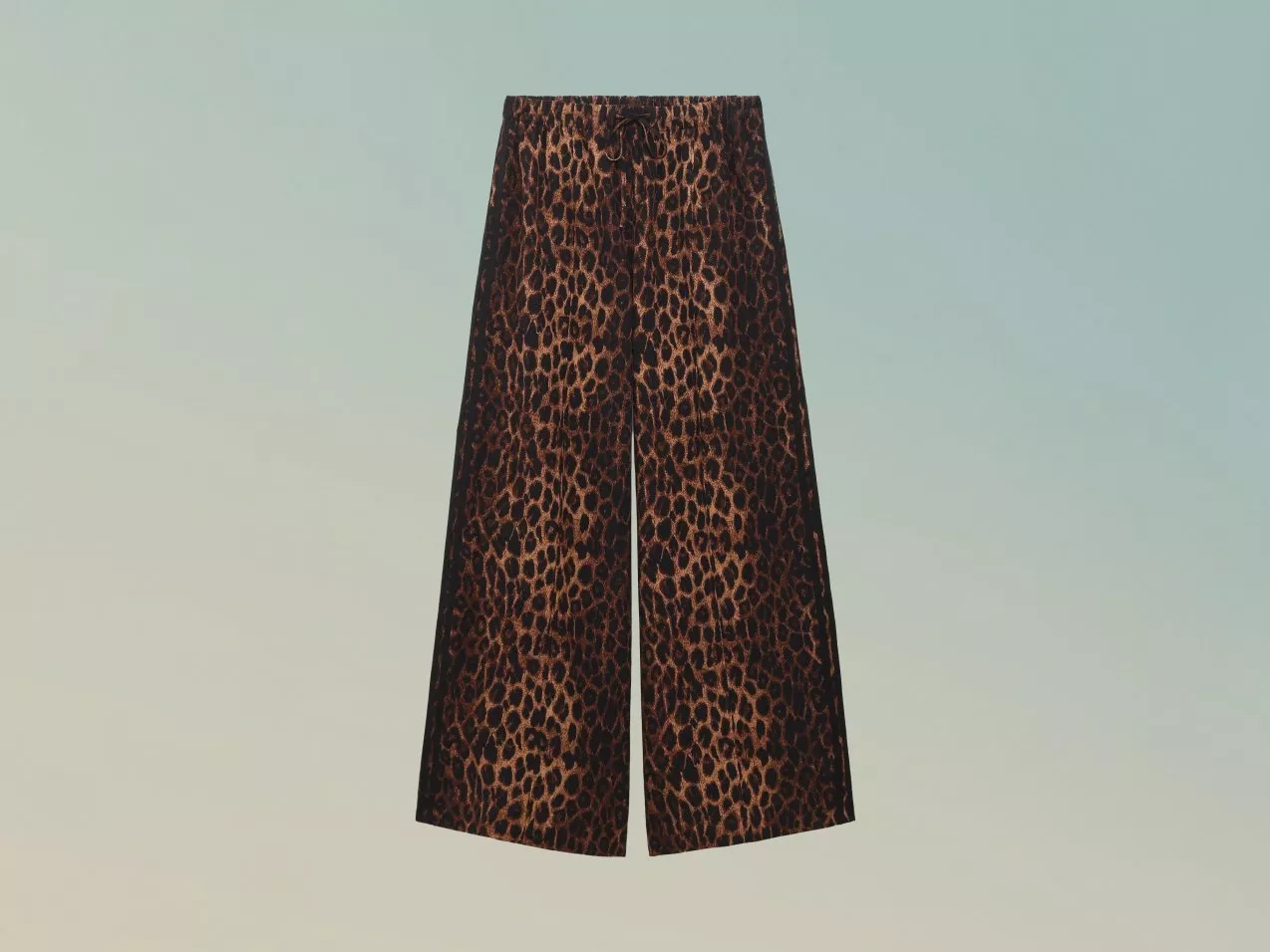 Leopard print wide-leg culottes with elasticated waist and drawstring, cropped length on plain backdrop