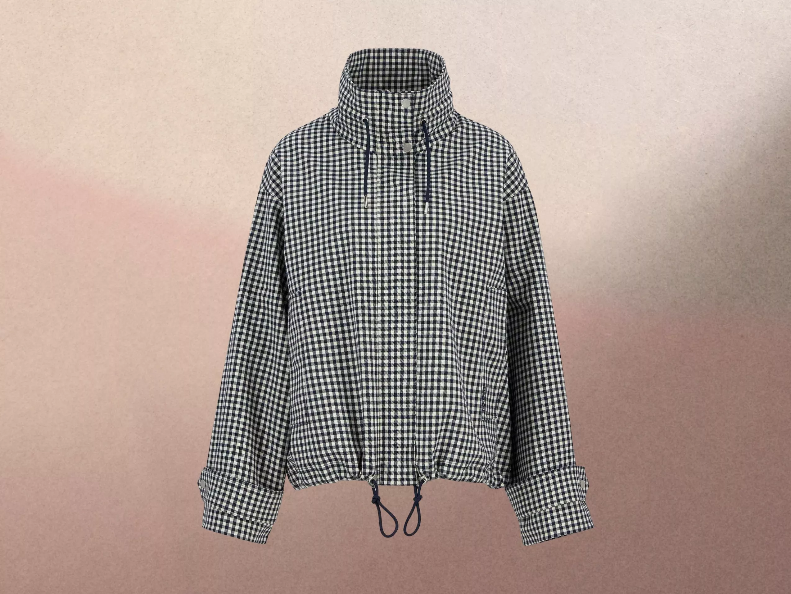 Gingham jacket with high collar and drawstring, set against a subtle gradient background.