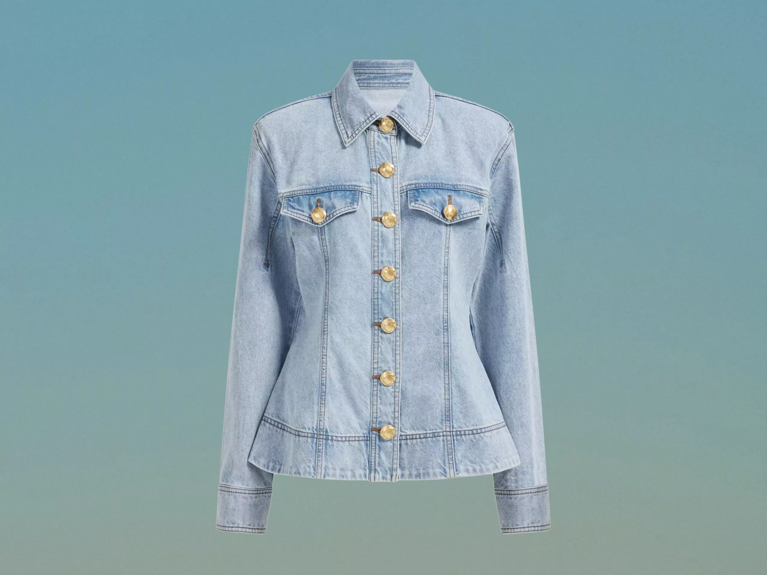 Light blue denim jacket with gold buttons, pointed collar and flap pockets, isolated on a light blue background