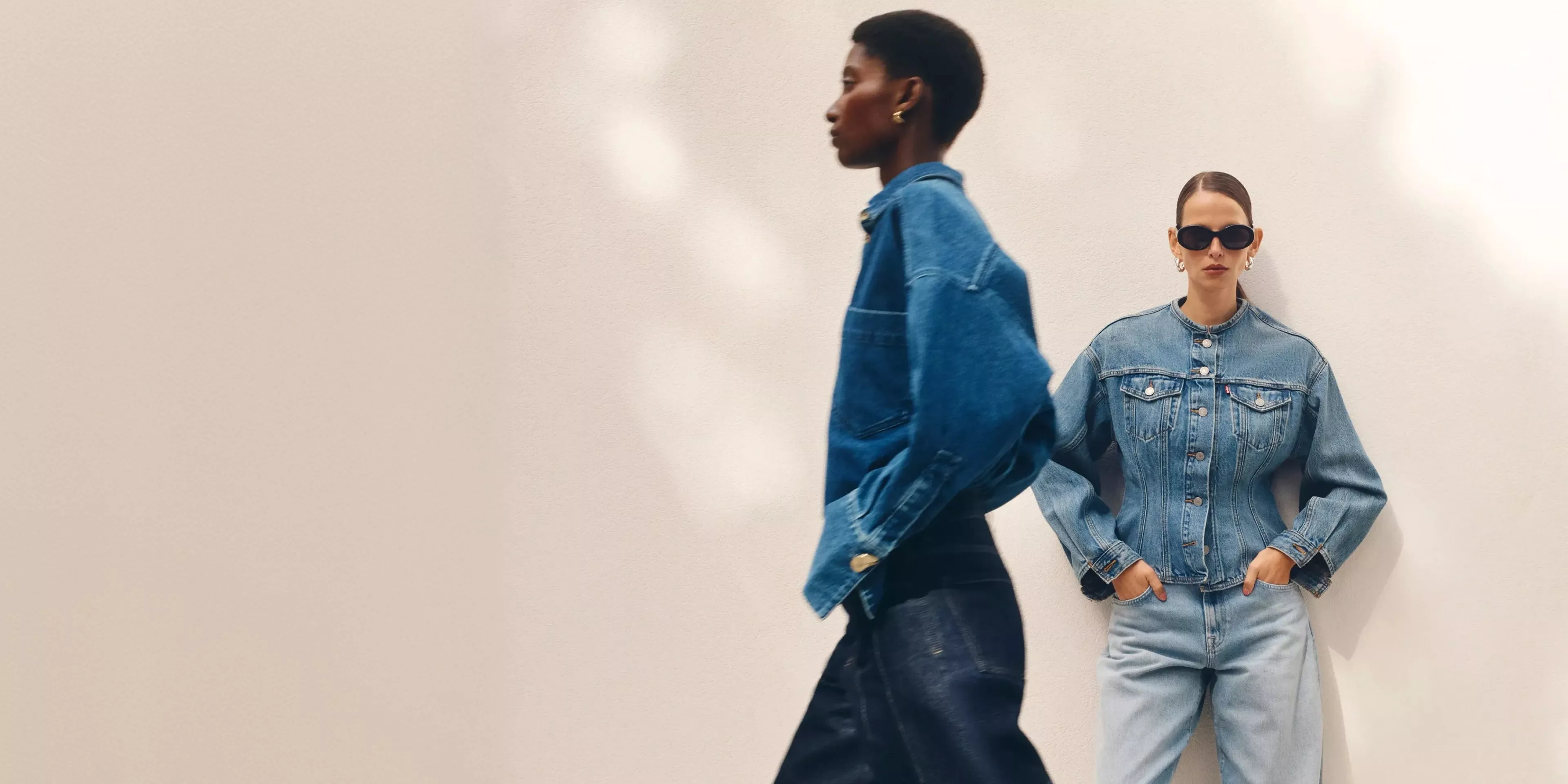 Two ladies wearing denim jeans and jackets