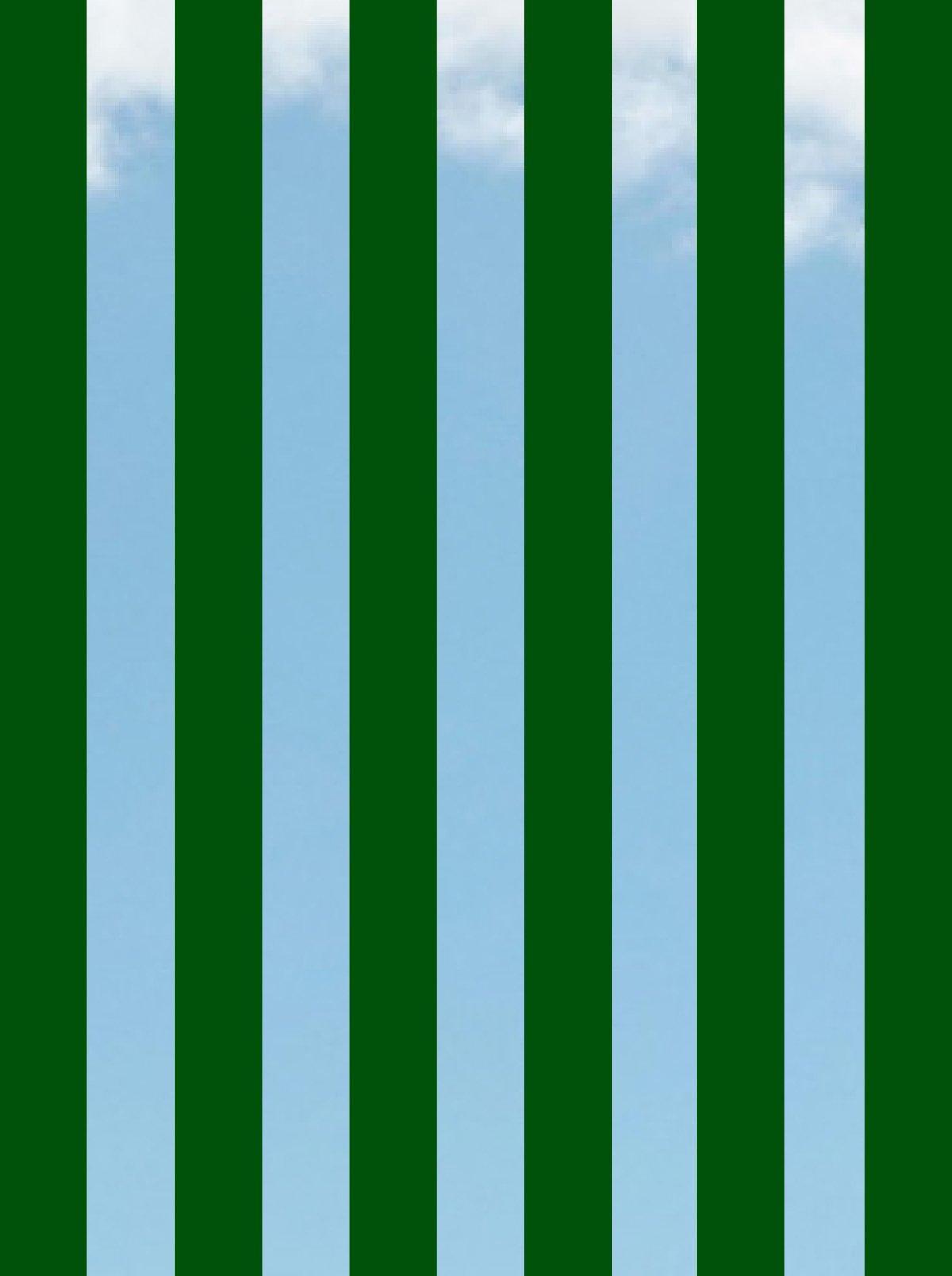 Blue sky background with dark vertical green stripes