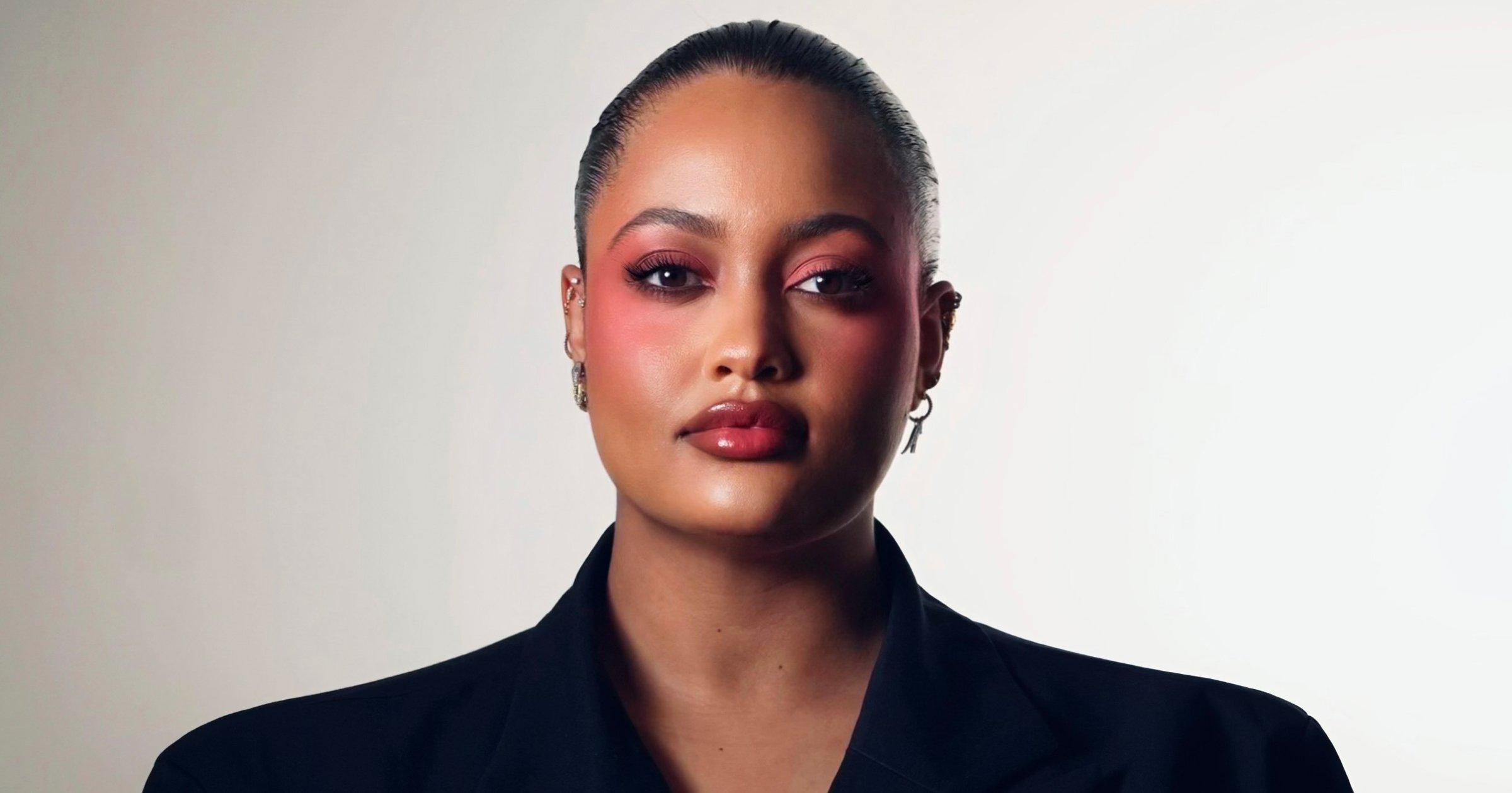 Fenty Beauty’s Global Ambassador Naïma Bremer in the center, with two of her works on both sides