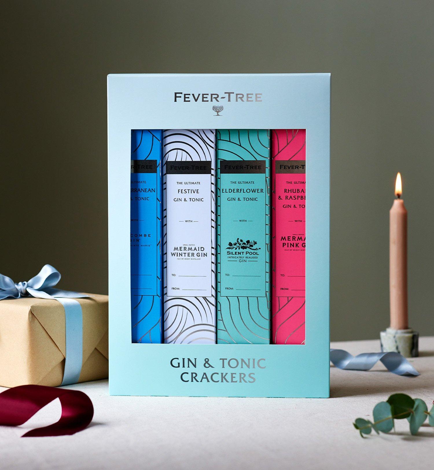 Box of Gin & Tonic crackers next to Christmas presents