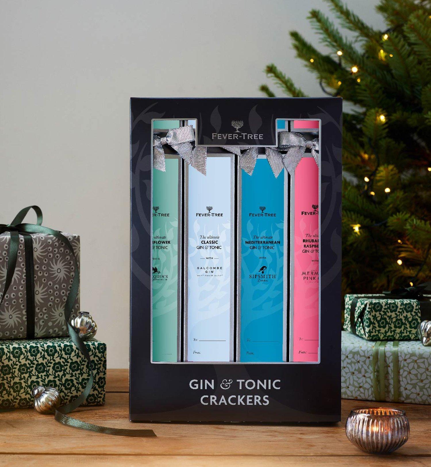 Box of Gin & Tonic crackers next to Christmas presents