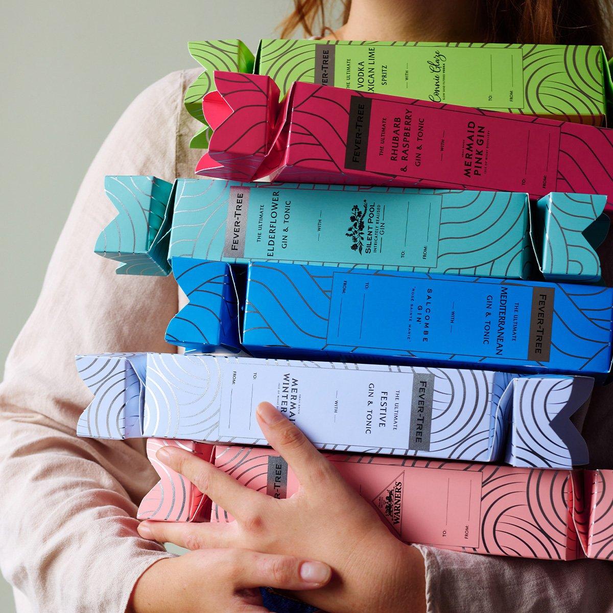 A stacked pile of Fever-Tree crackers being held by a woman