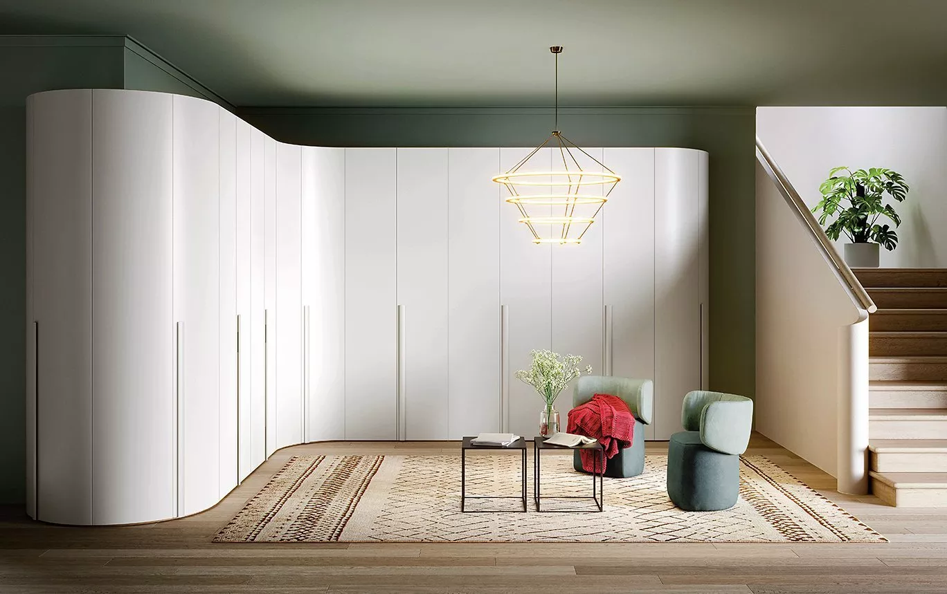 white curved filled wardrobe