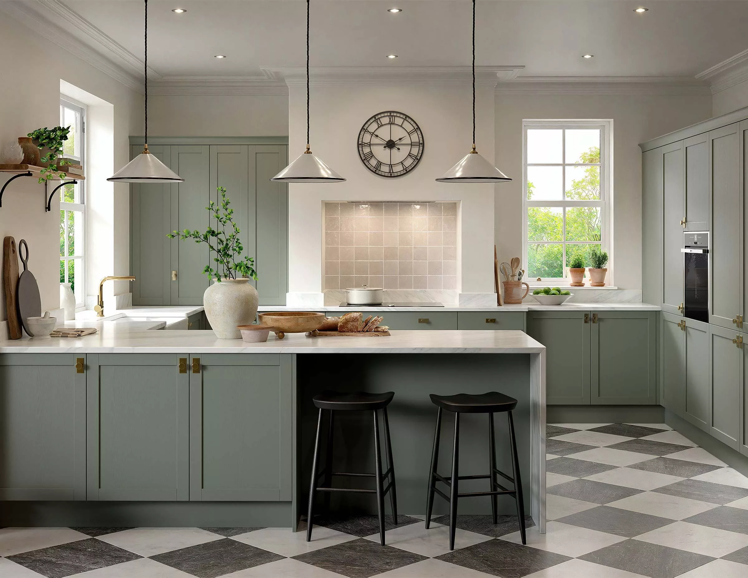 Kitchen setting with sage cabinets, white walls and black bar stools