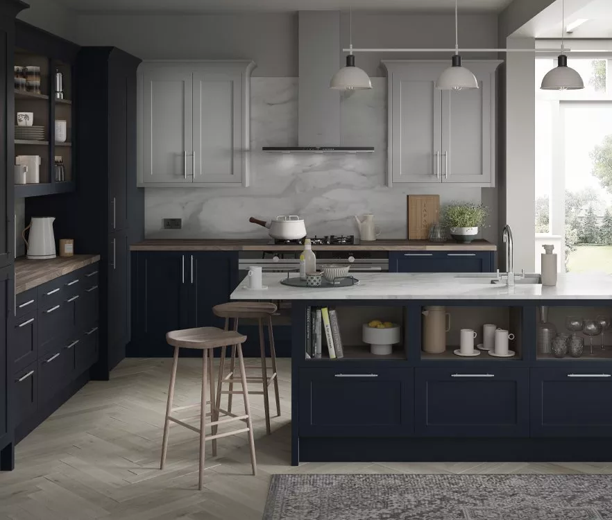 Kitchen setting with navy cabinets and white counters