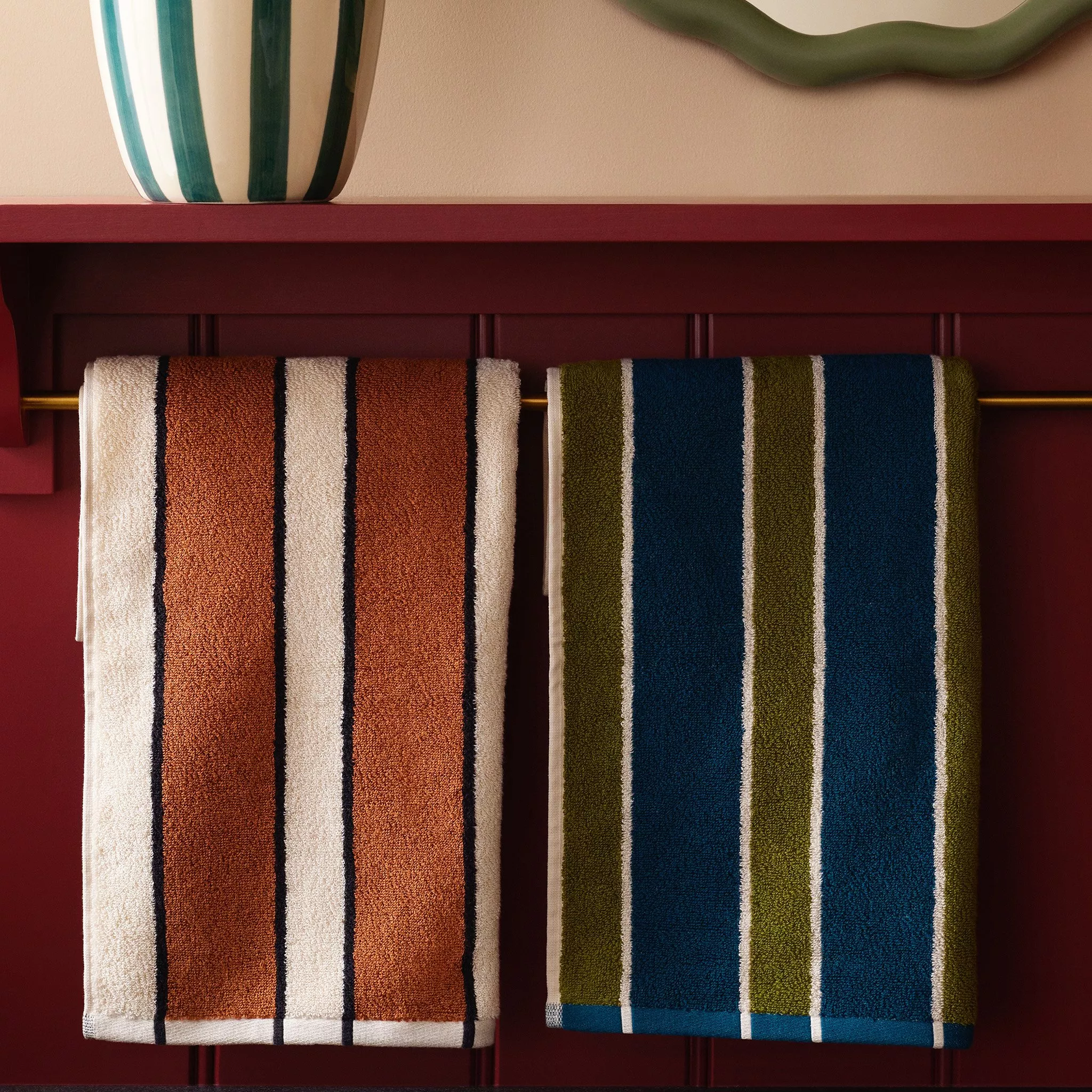 Stripey towels on a towel rail 