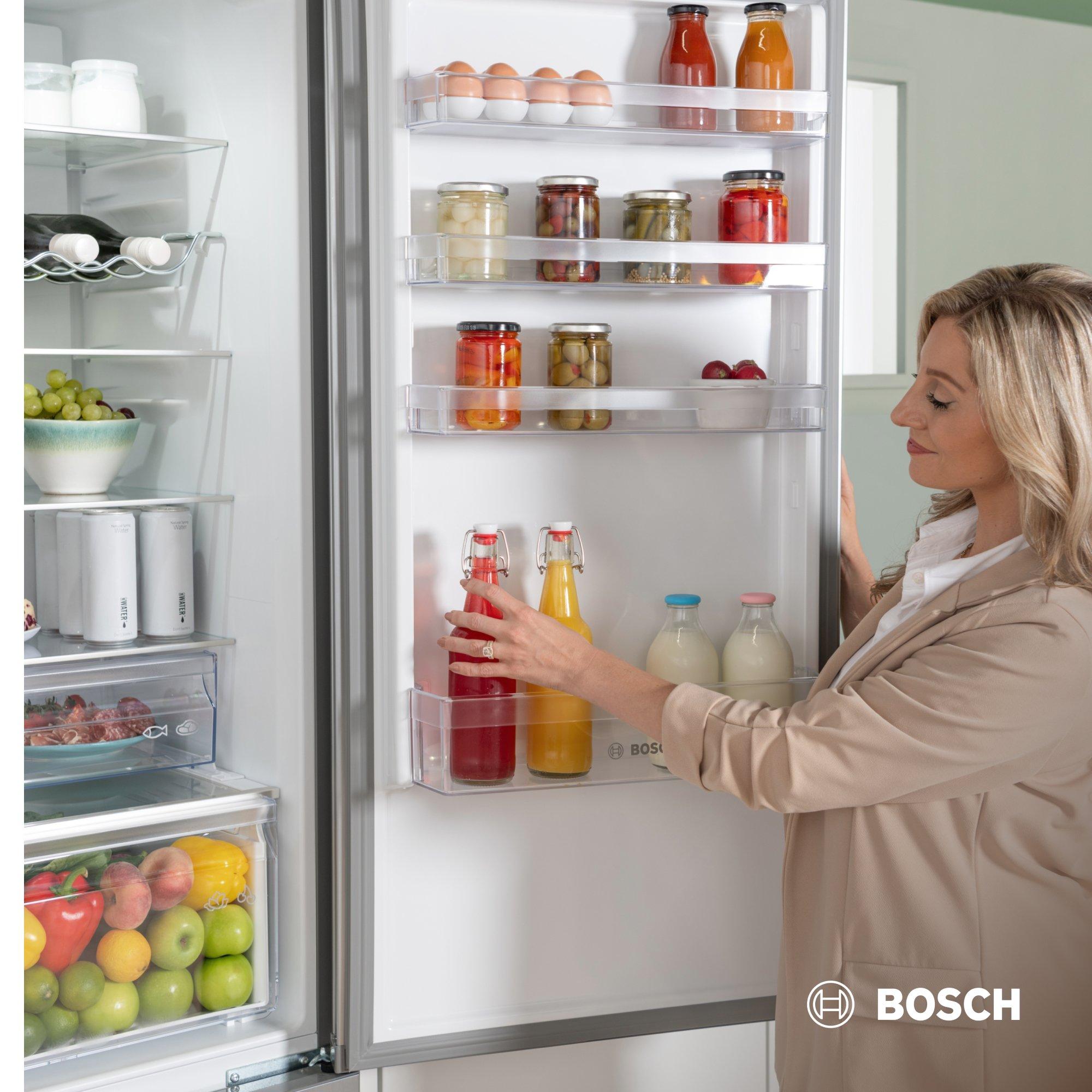 Woman reaching into a Bosch fridge
