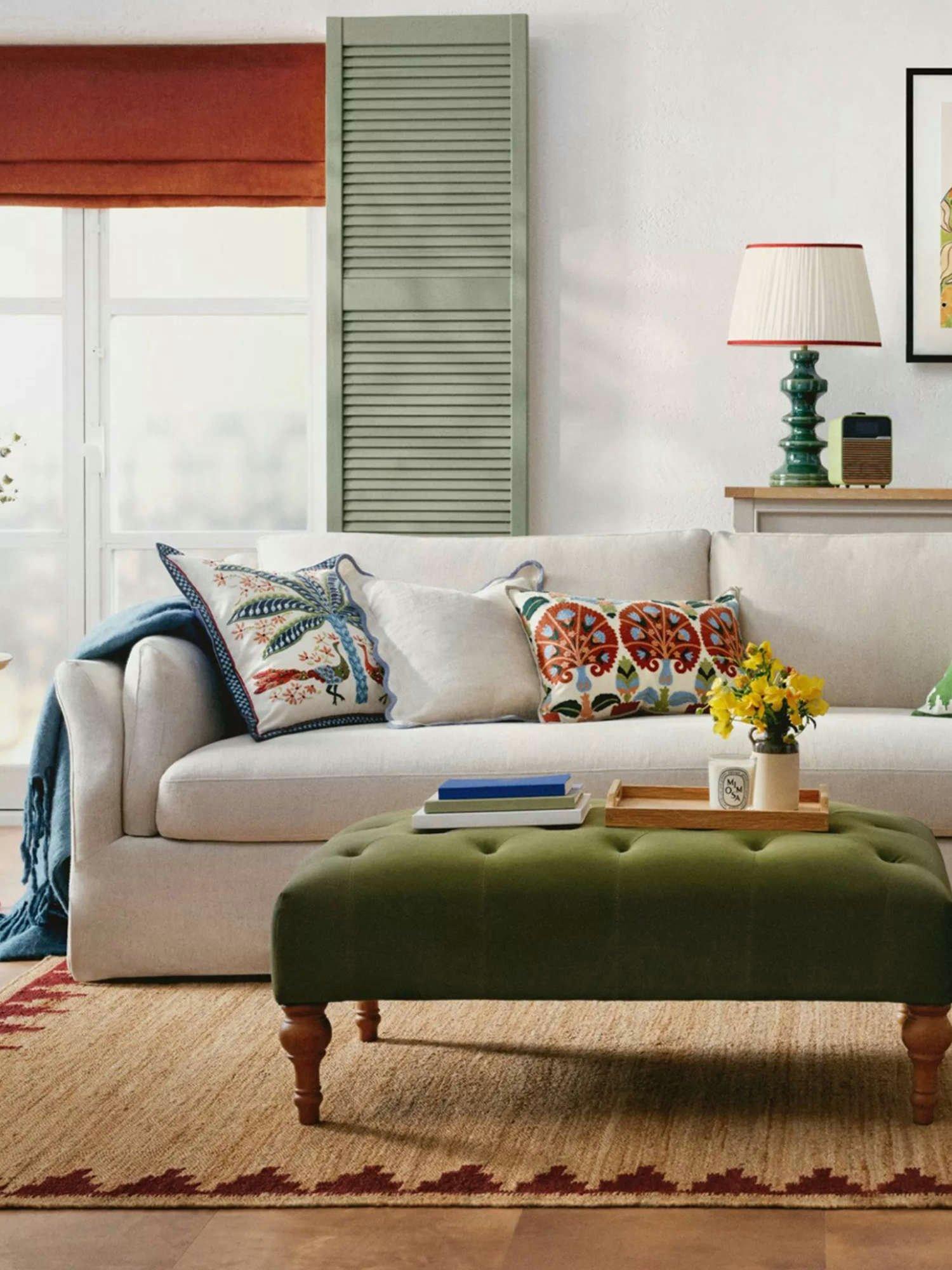 Sofa with throws and pillows on it