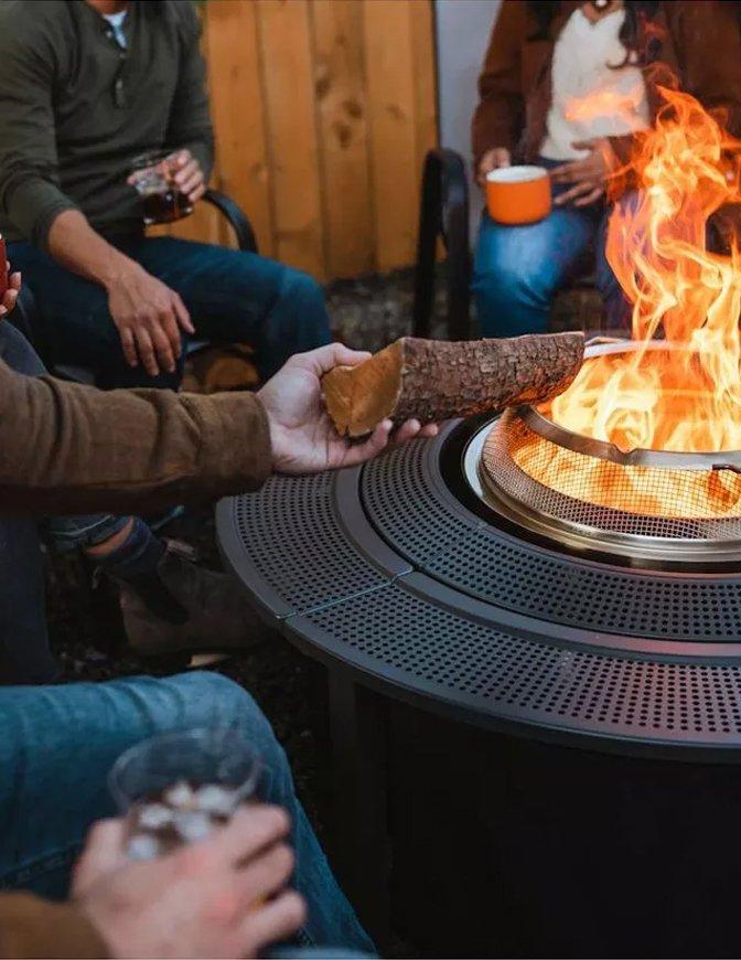Fire pit with people around it