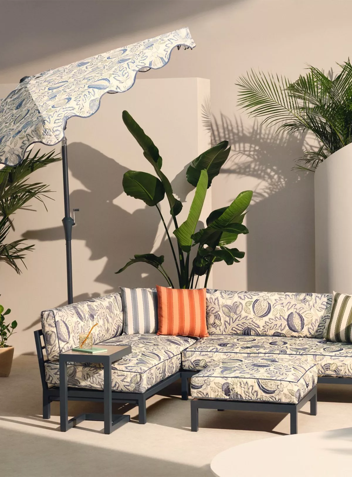 Green garden furniture with green and white striped cushions