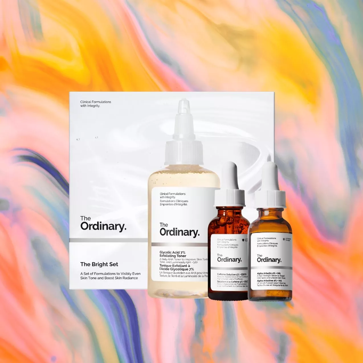 The Ordinary skincare set features three products against a vibrant, swirling orange and pink background.