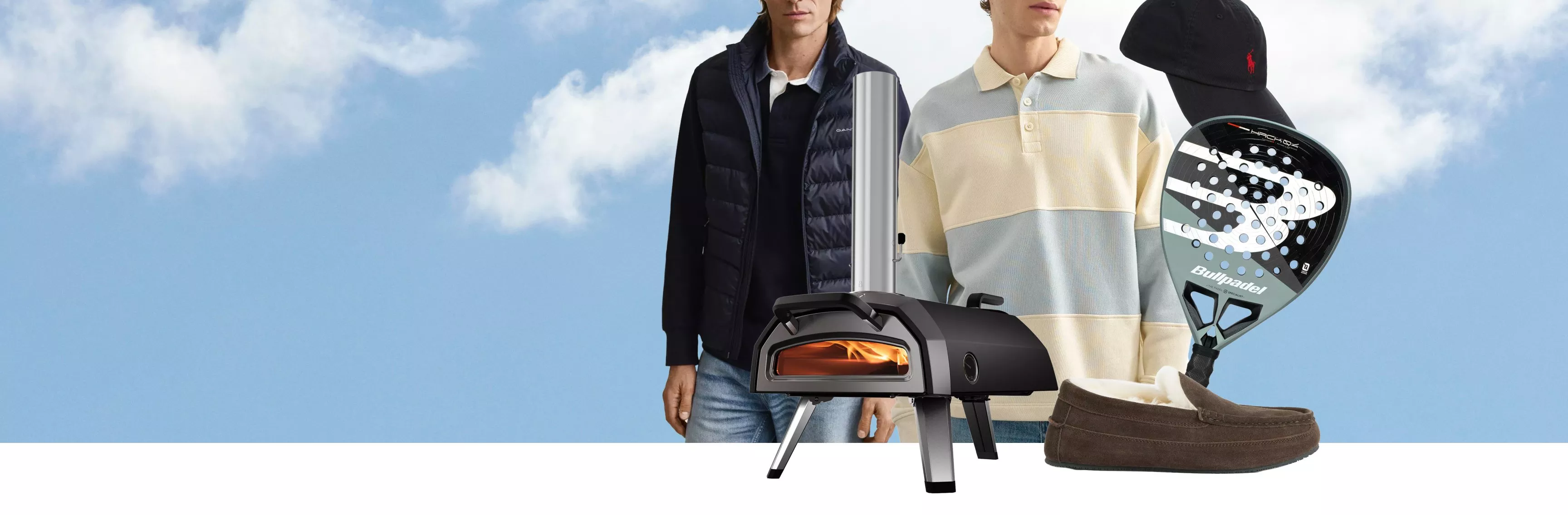Menswear banner with models, outdoor pizza oven, padel racket, baseball cap and suede loafers on sky backdrop