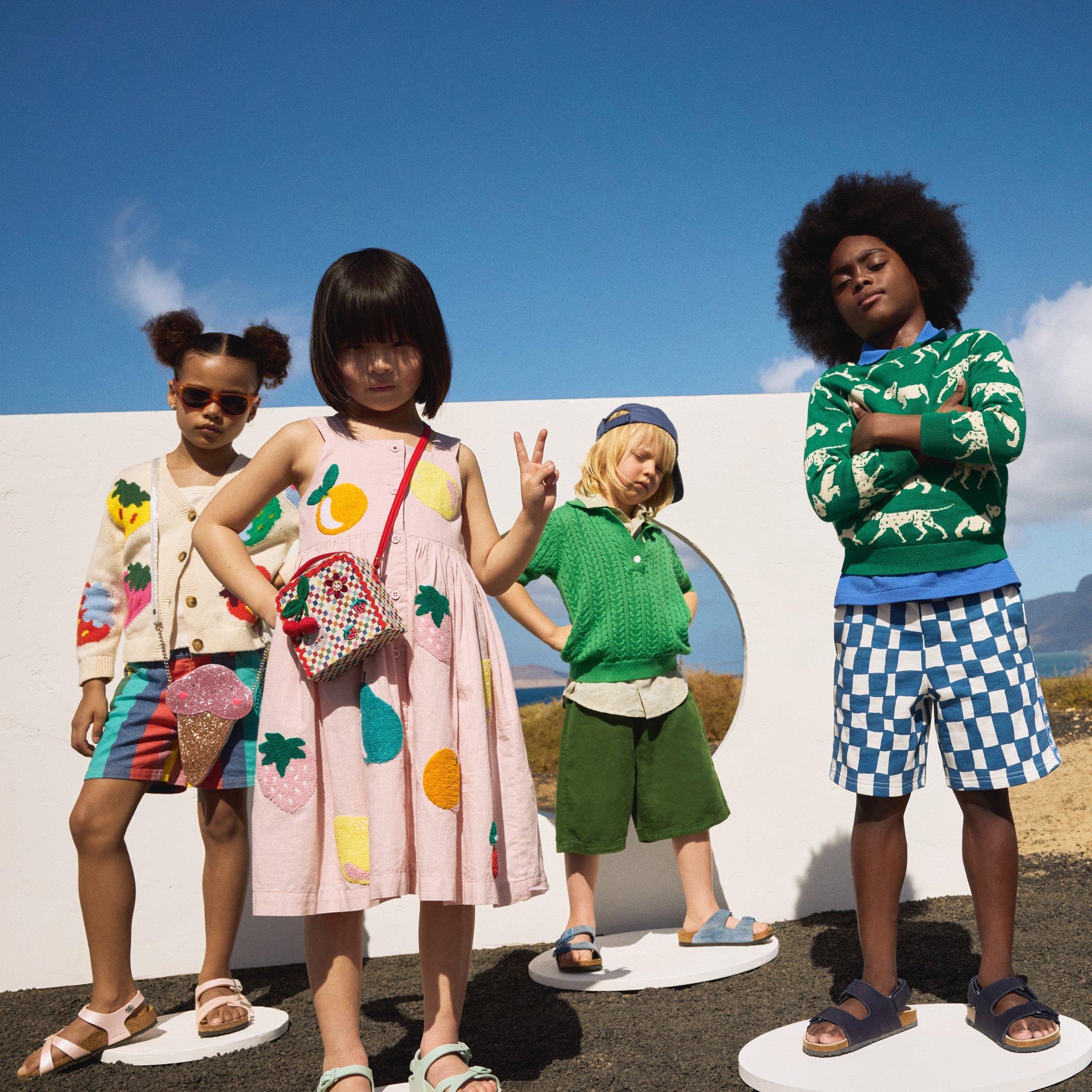 group of kids all dresses in summer clothes in sunny scene