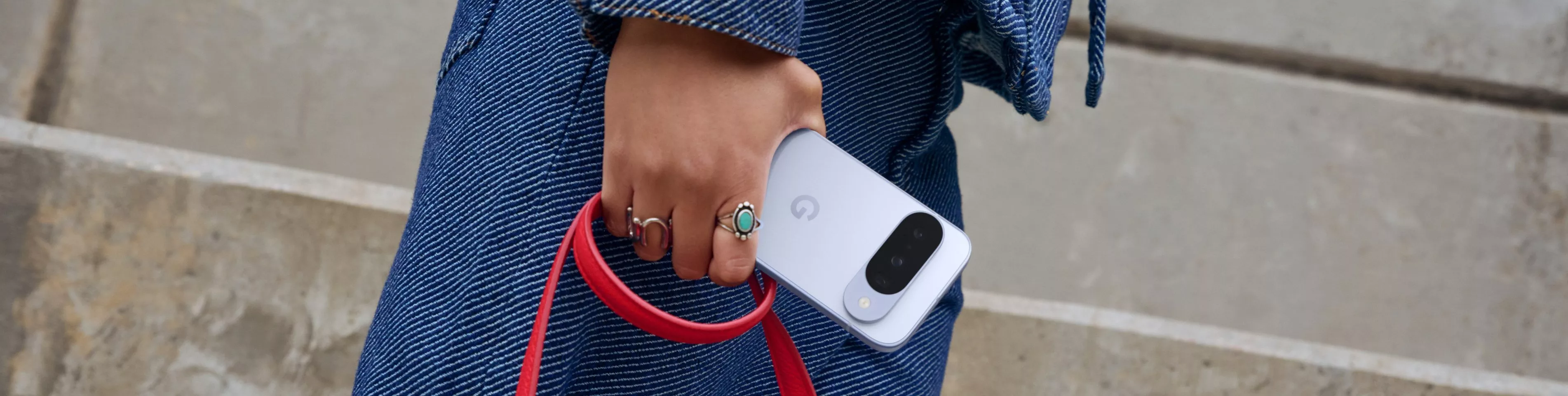 An image of a hand holding a Google Pixel phone