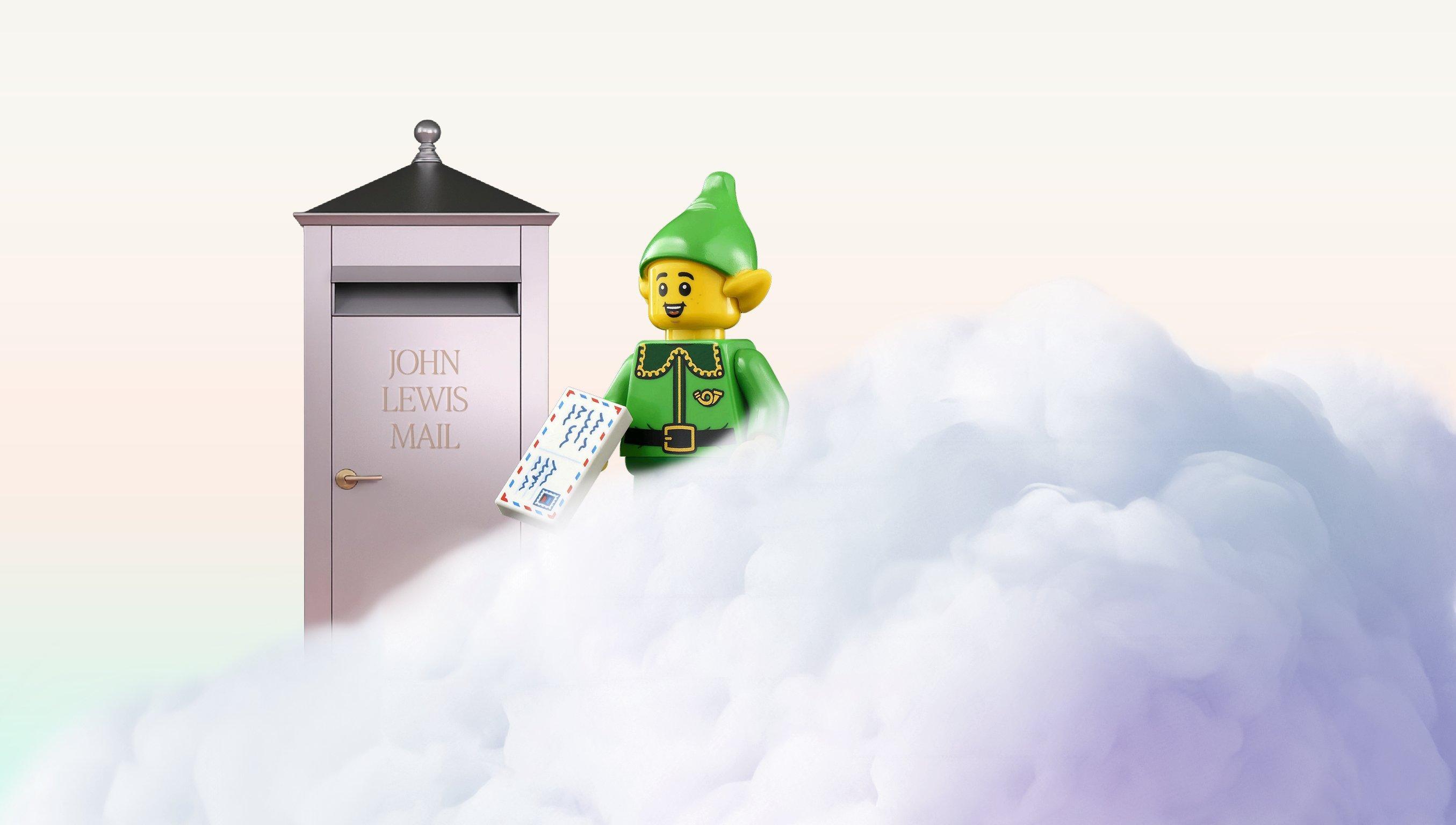 A metallic post box next to a cloud