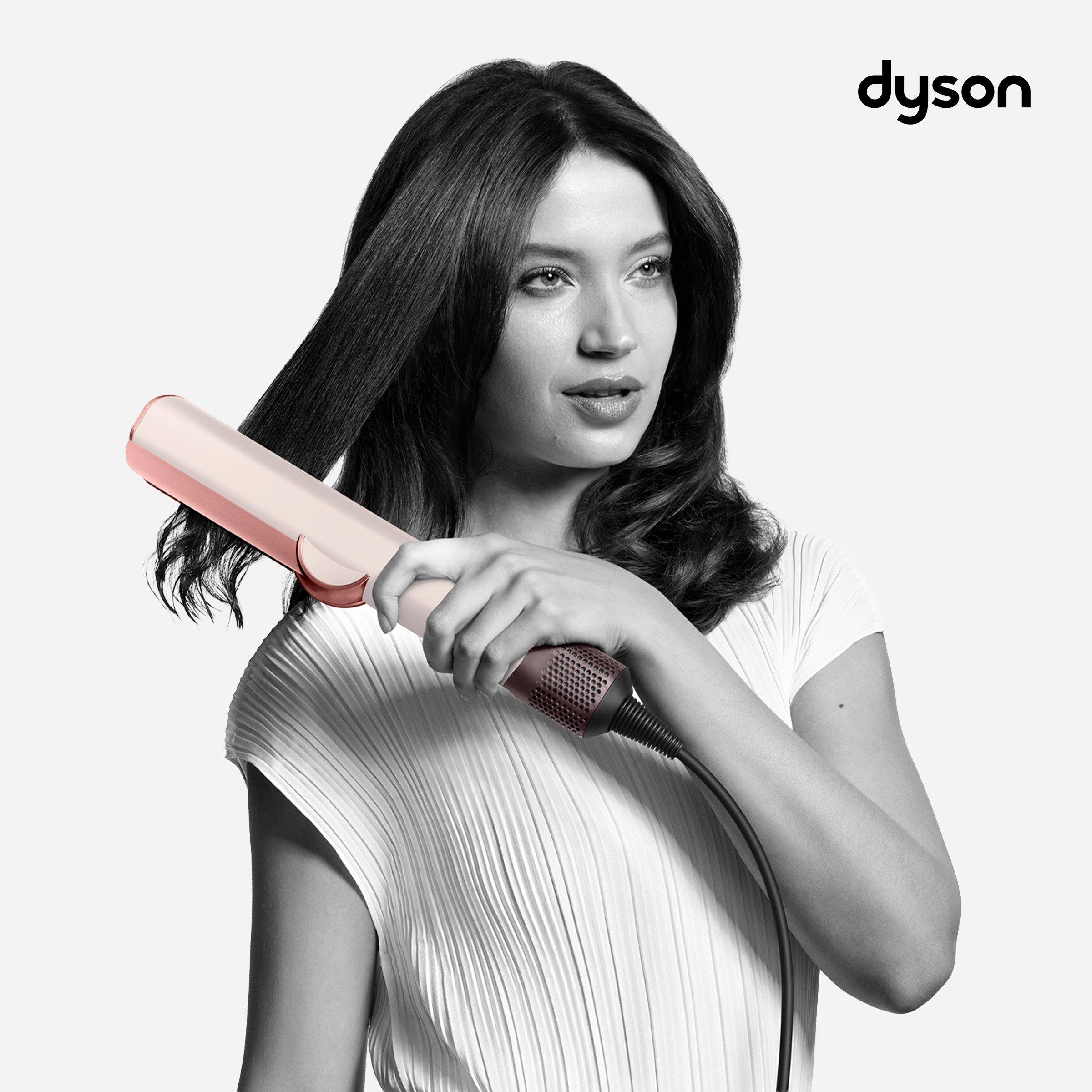 Women using dyson hair straightner