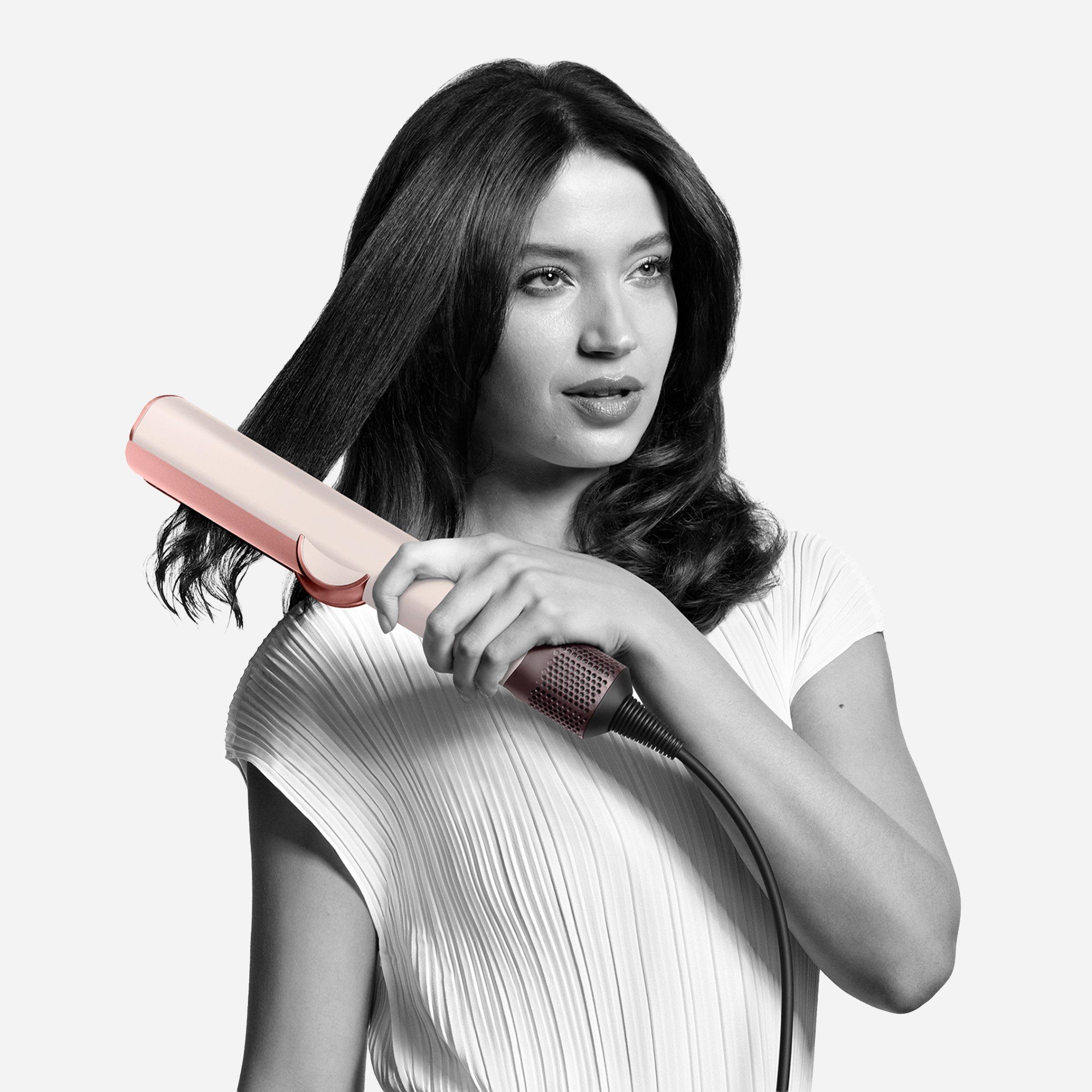 Women using dyson hair straightner