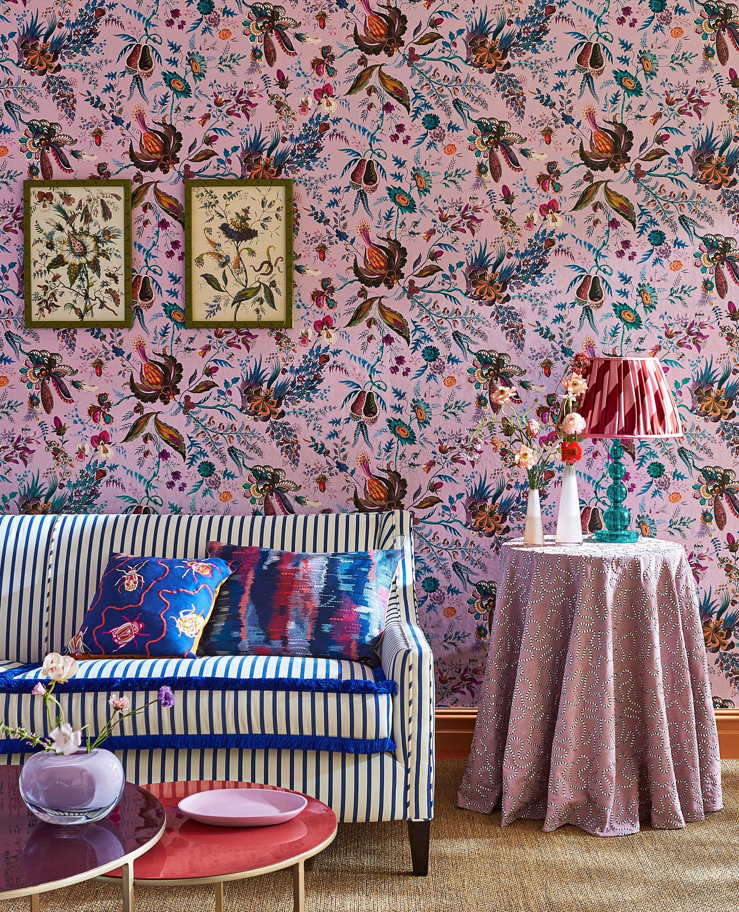 product shot of a very bright Sophie Robinson designed wallpaper set in a lounge setting
