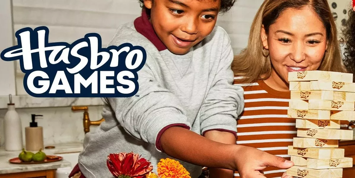A banner image showing showing children playing with Hasbro game.
