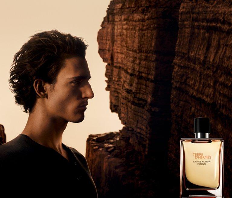 A brand banner showing a male in darkness and light.