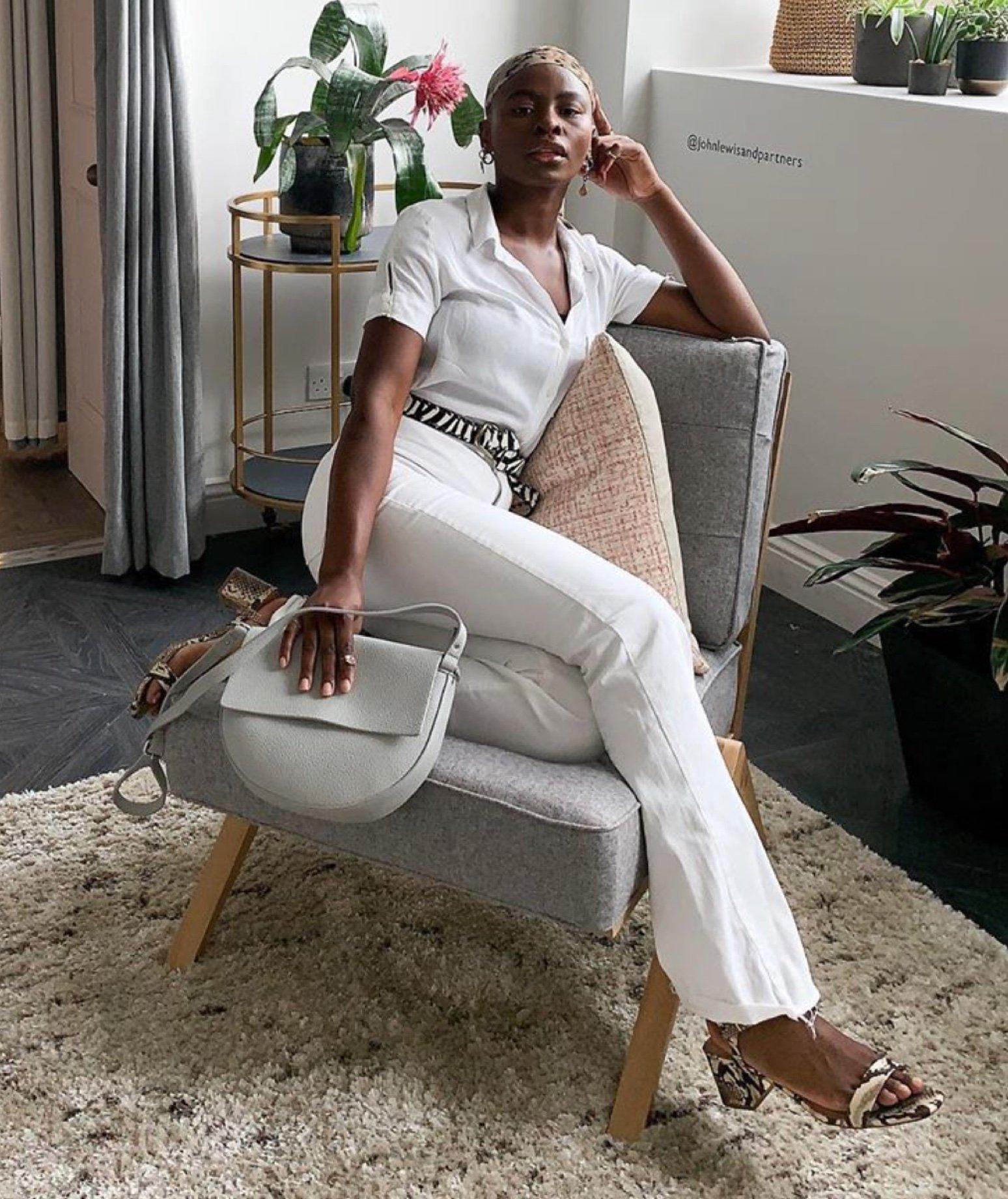 Promise in her white outfit and animal print